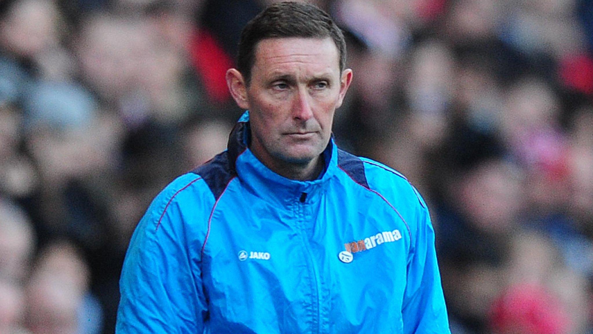 Truro City manager Lee Hodges looks on from the sidelines