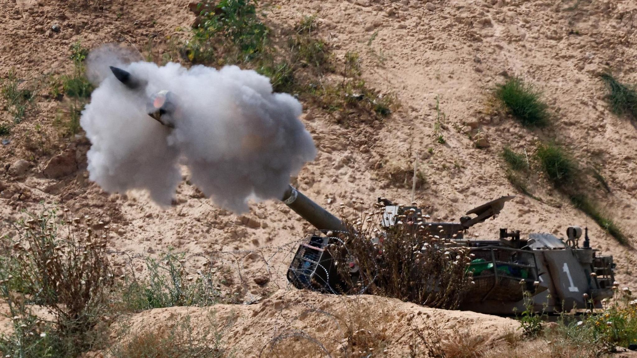 Israeli artillery fires a shell towards the Gaza Strip, as seen from southern Israel (6 May 2025)