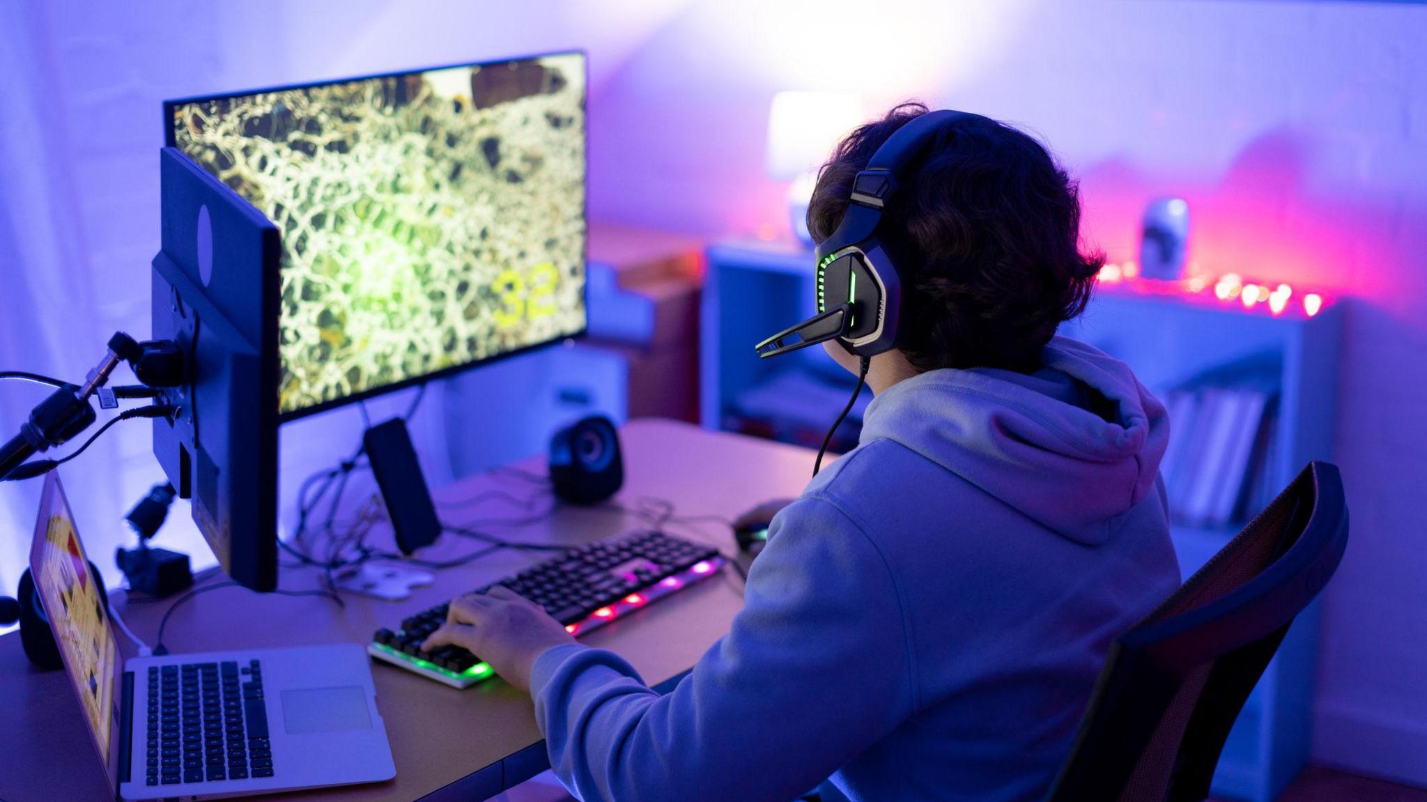 a child using a gaming pc