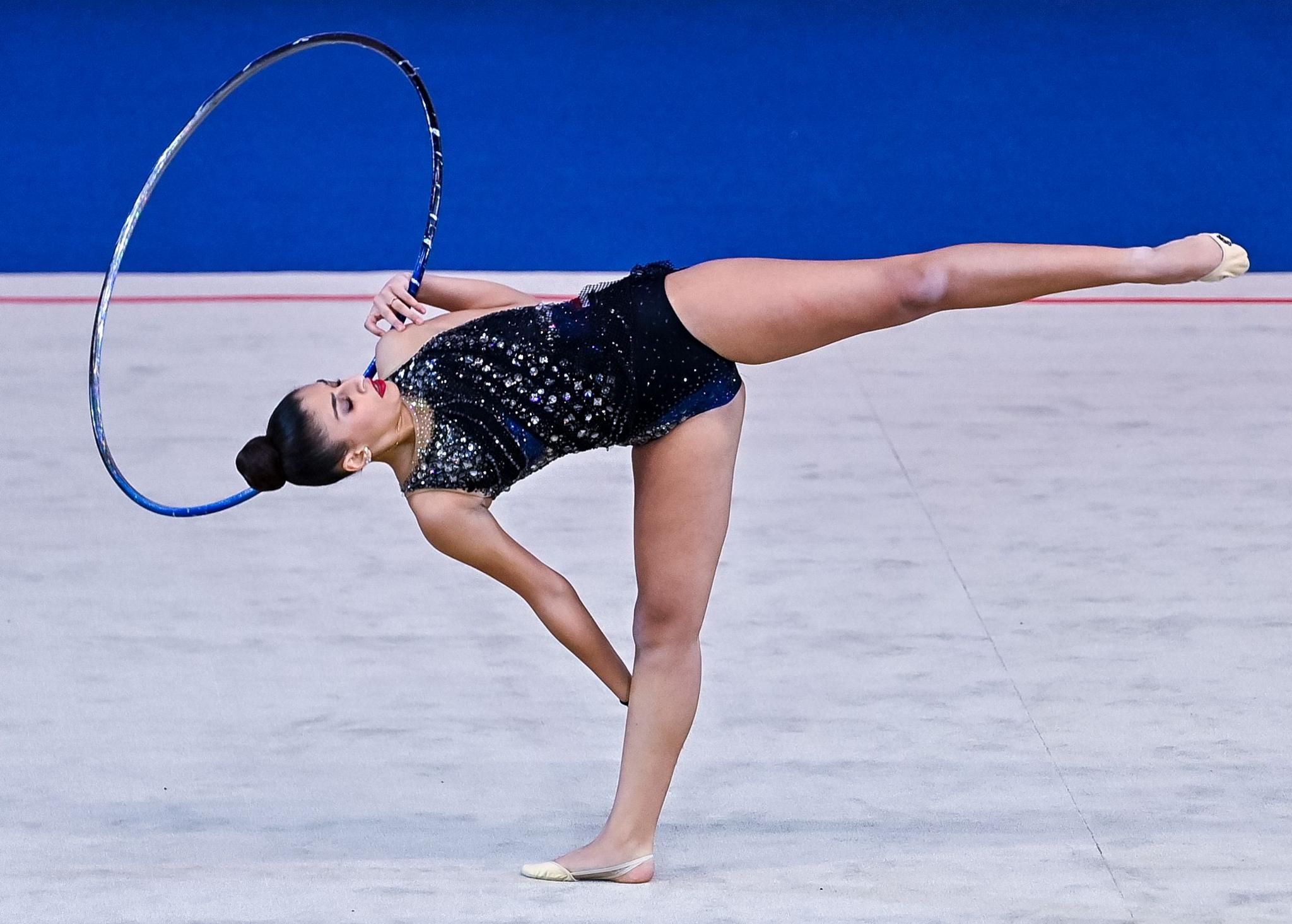 Habiba Aly of Egypt performs a daring hoop exercise during the International Rhythmic Gymnastics Tournament in Doha, Qatar - Wednesday 20 November 2024