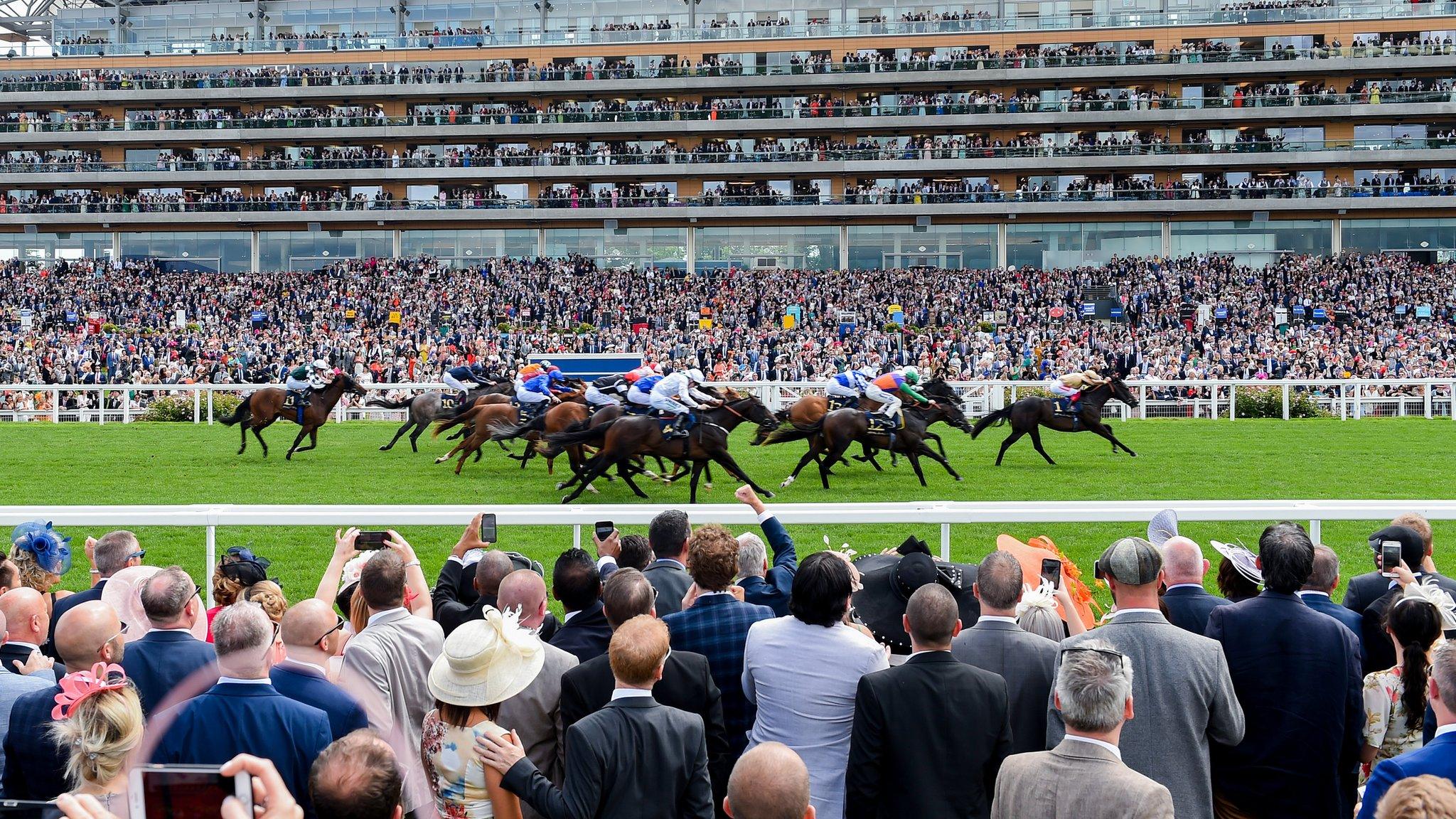 ASCOT, ENGLAND - JUNE 20: A general view of racegoers watching a race from the Village Enclosure on day 3 of Royal Ascot at Ascot Racecourse on June 20, 2019 in Ascot, England. (Photo by Stuart C. Wilson/Getty Images for Ascot Racecourse )