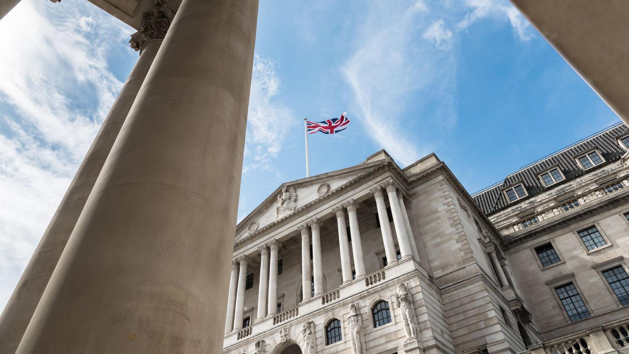 The Bank of England building with a pillar in front of it, taken from pavement level