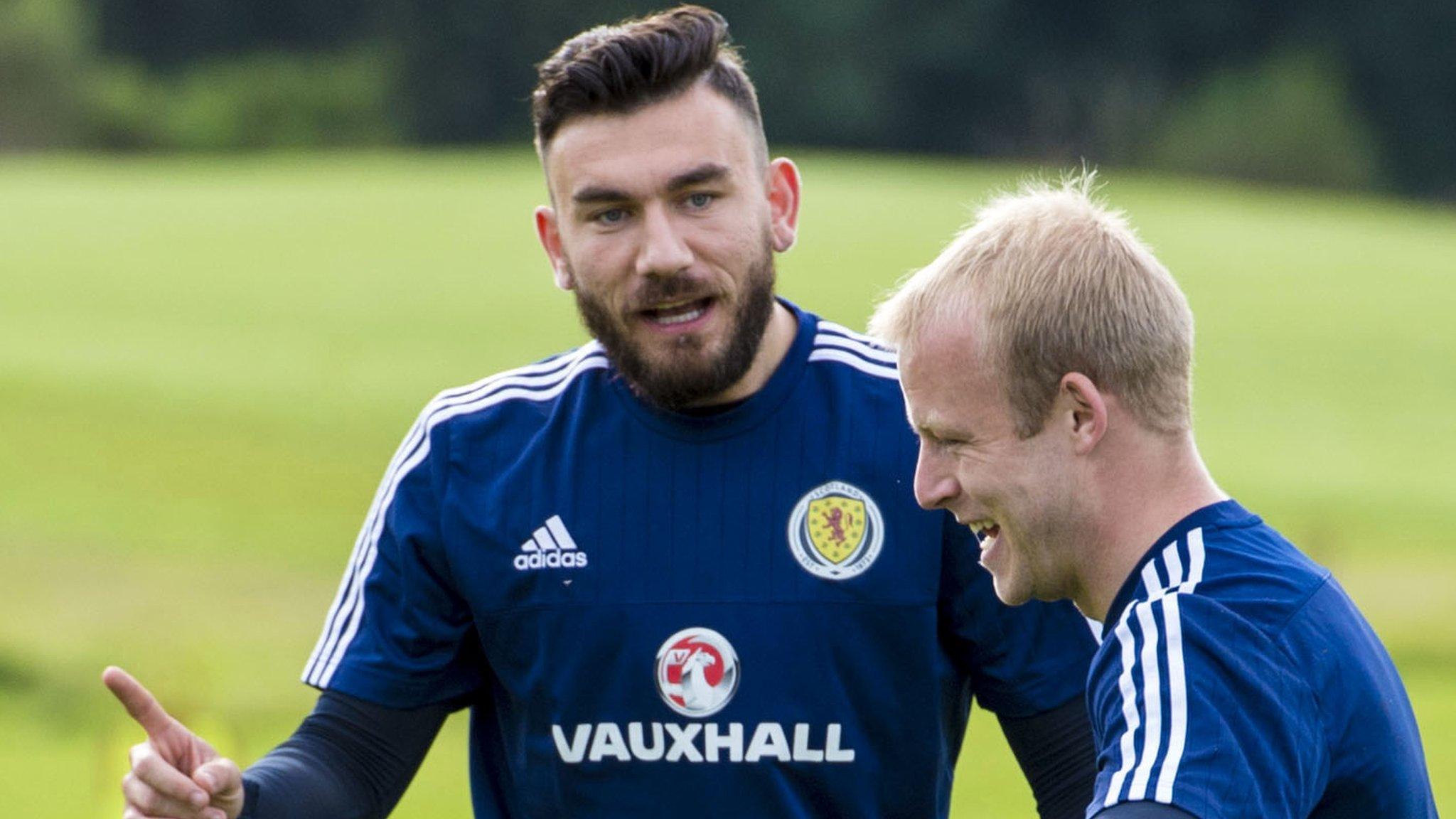 Scotland's Robert Snodgrass shares a joke with Steven Naismith