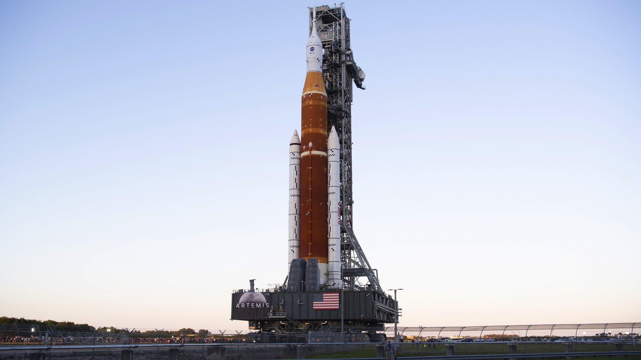 A handout photo made available by NASA shows NASA's Space Launch System (SLS) rocket with the Orion spacecraft aboard