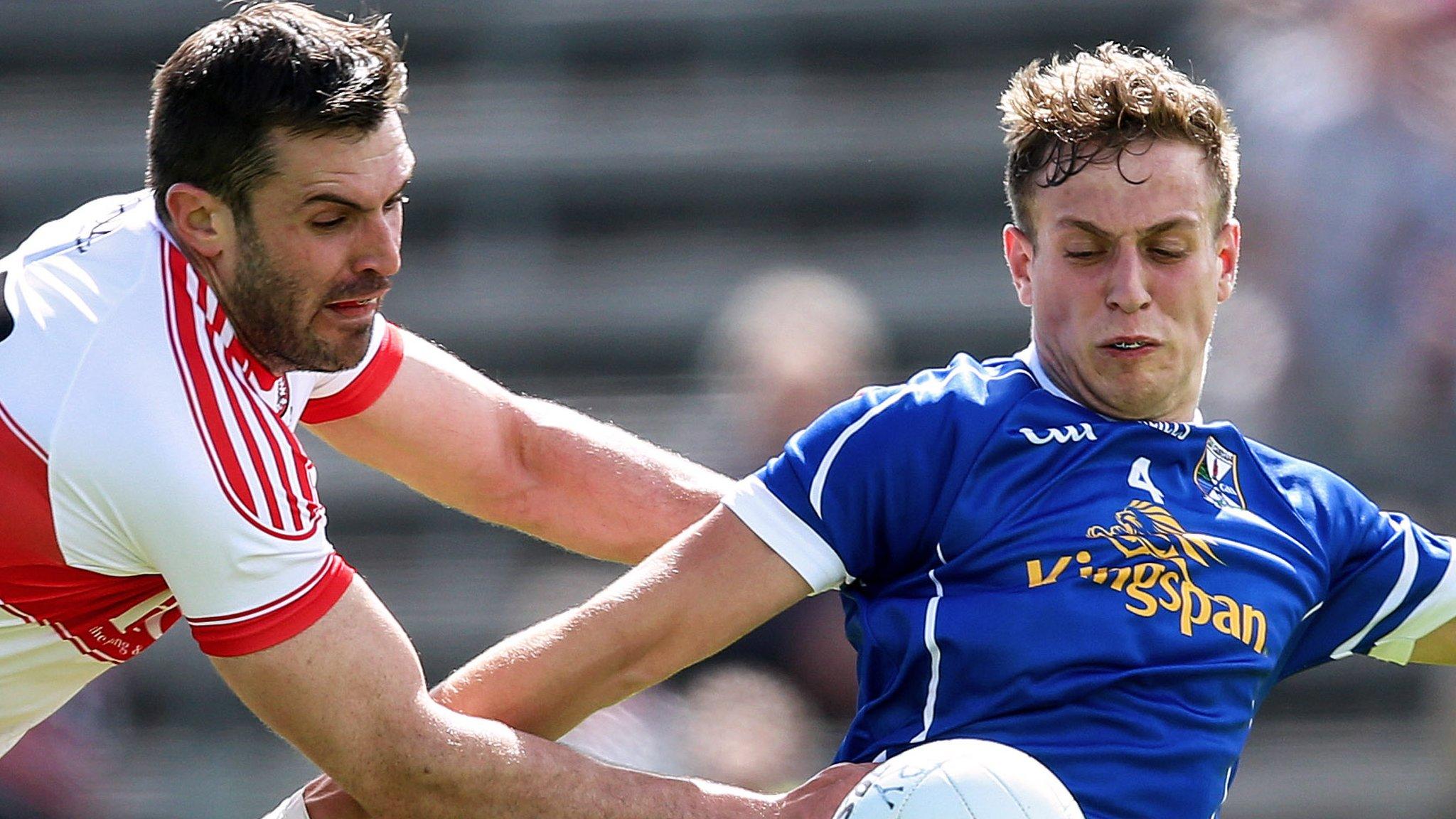 Mark Lynch of Derry challenges Cavan's Padraig Faulkner at Breffni Park