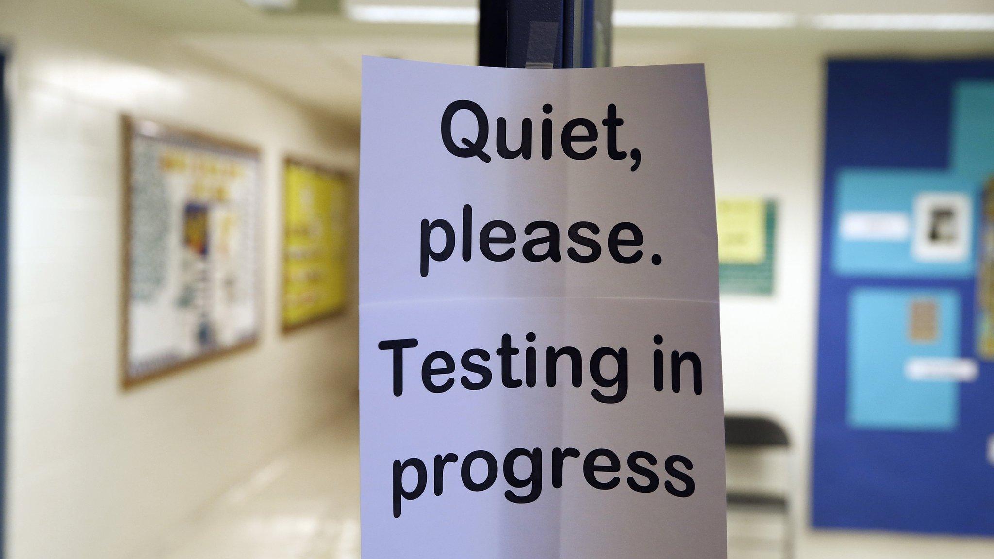 Sign in school warning that testing is in progress