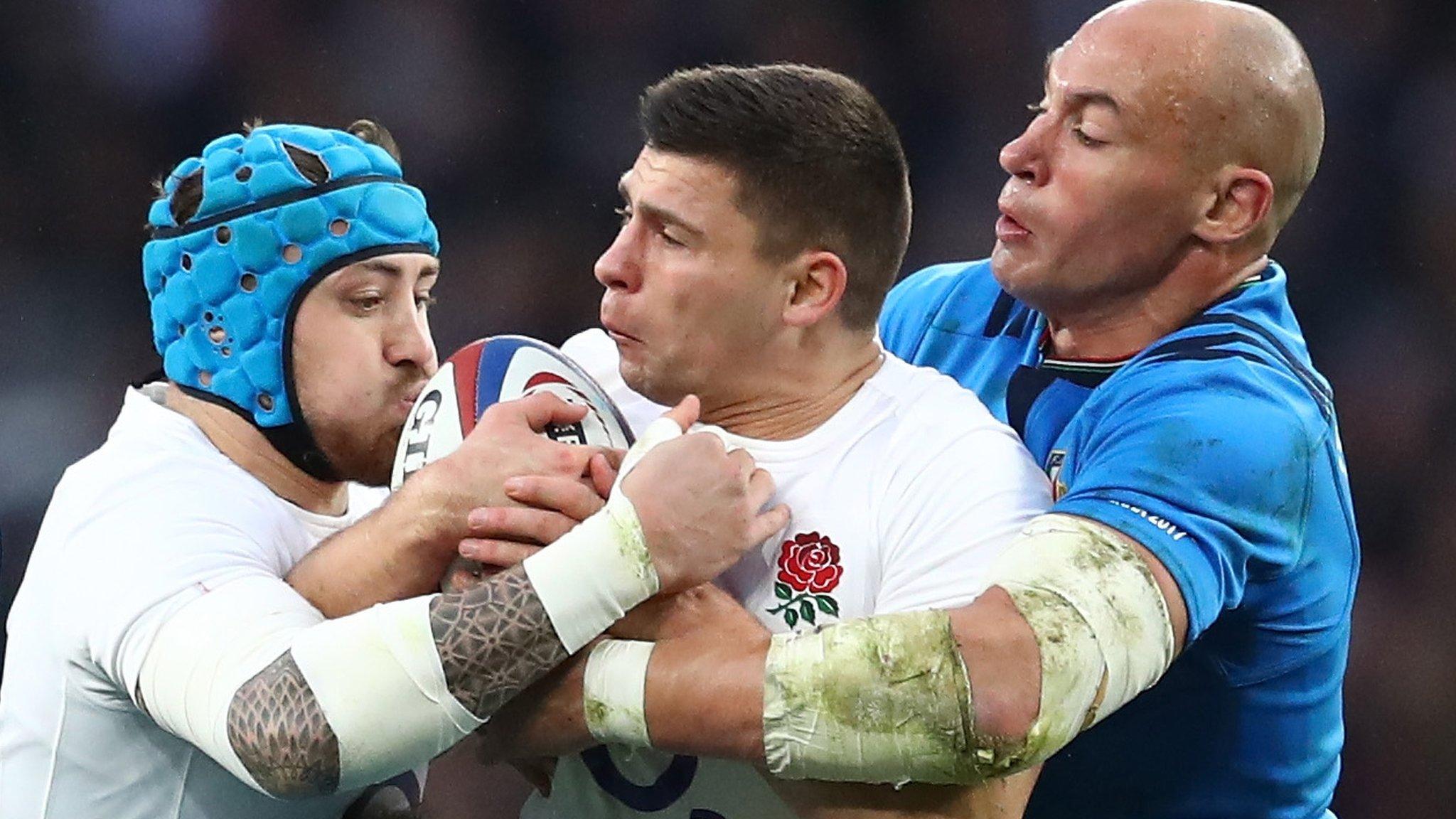 Italy captain Sergio Parisse tackles England's Ben Youngs