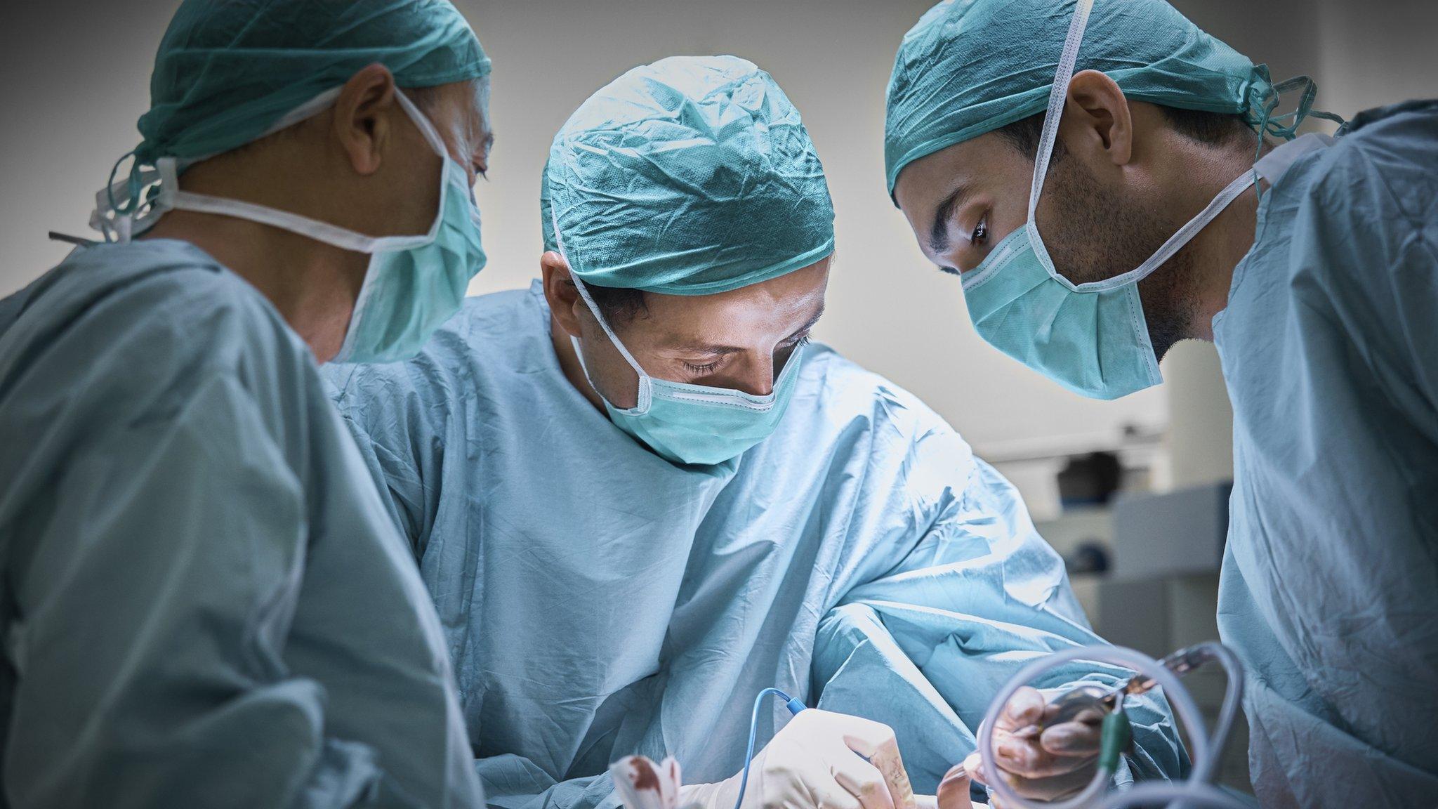 Doctors in an operating theatre