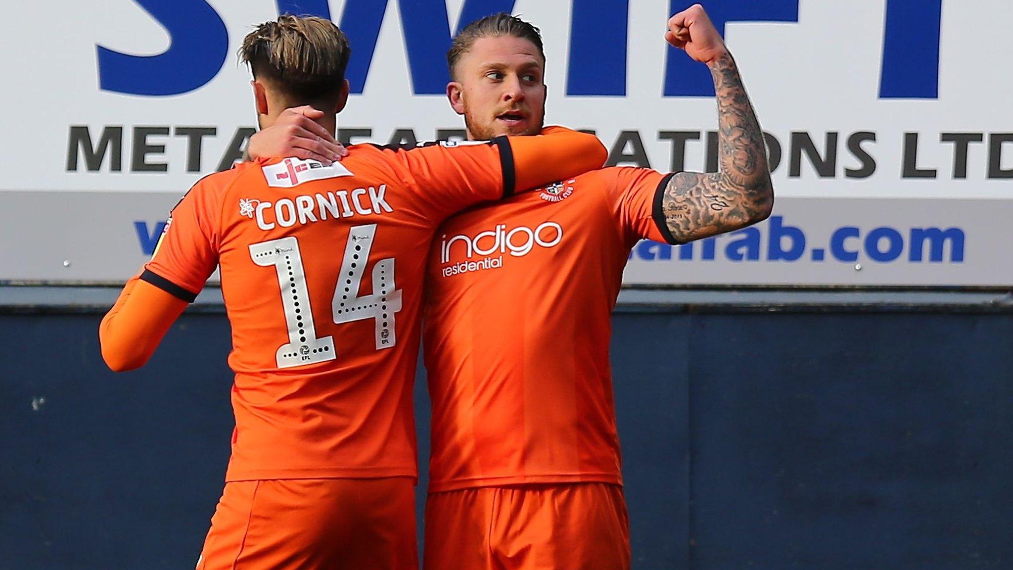 George Moncur celebrates with Harry Cornick