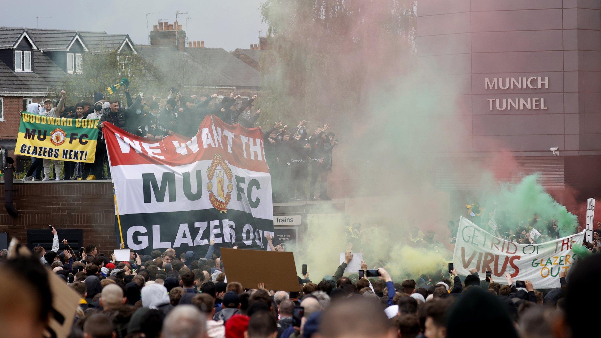 Manchester United fans protest outside Old Trafford against the club's ownership under the Glazer family