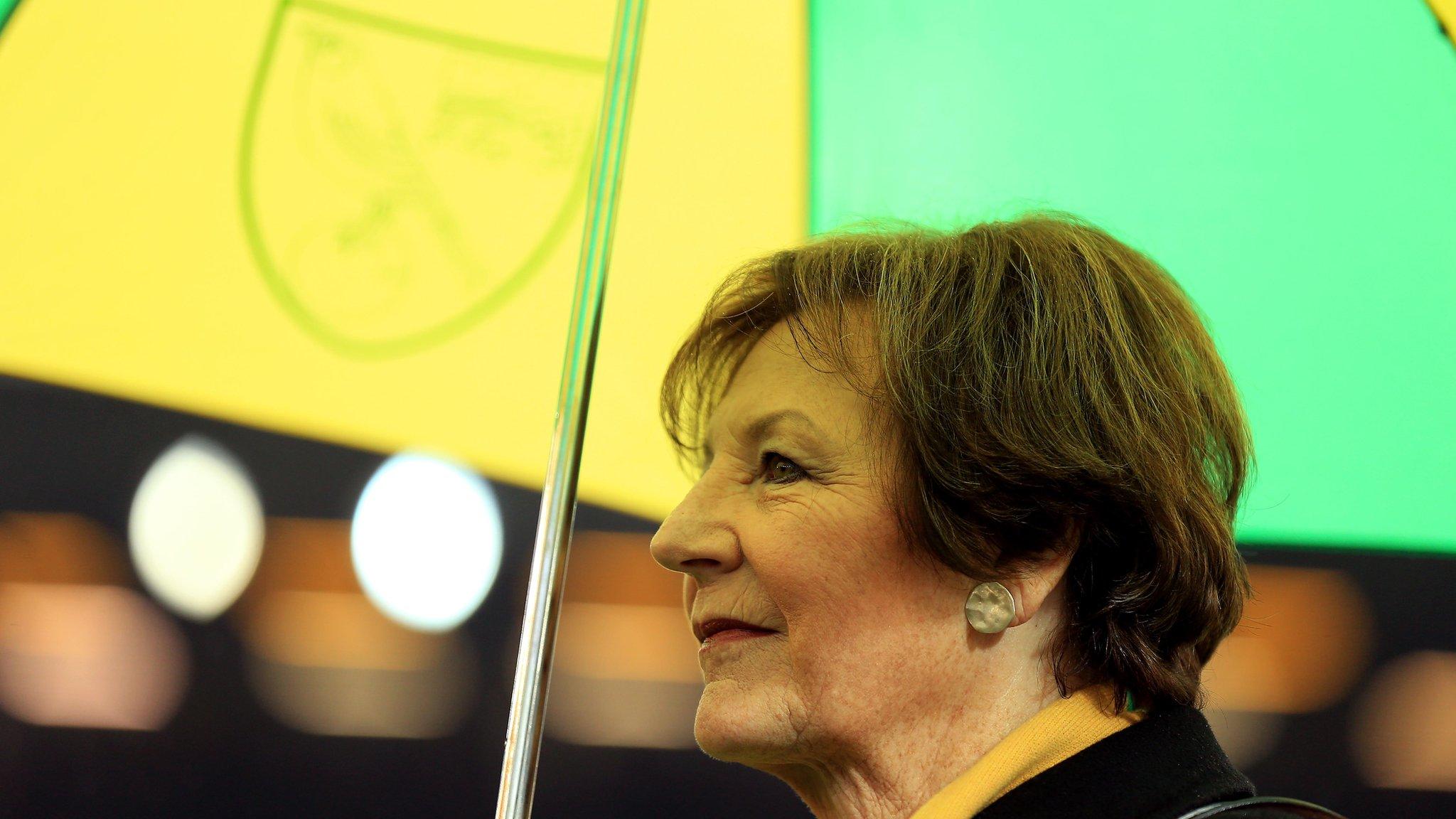 Delia Smith holding a Norwich City umbrella