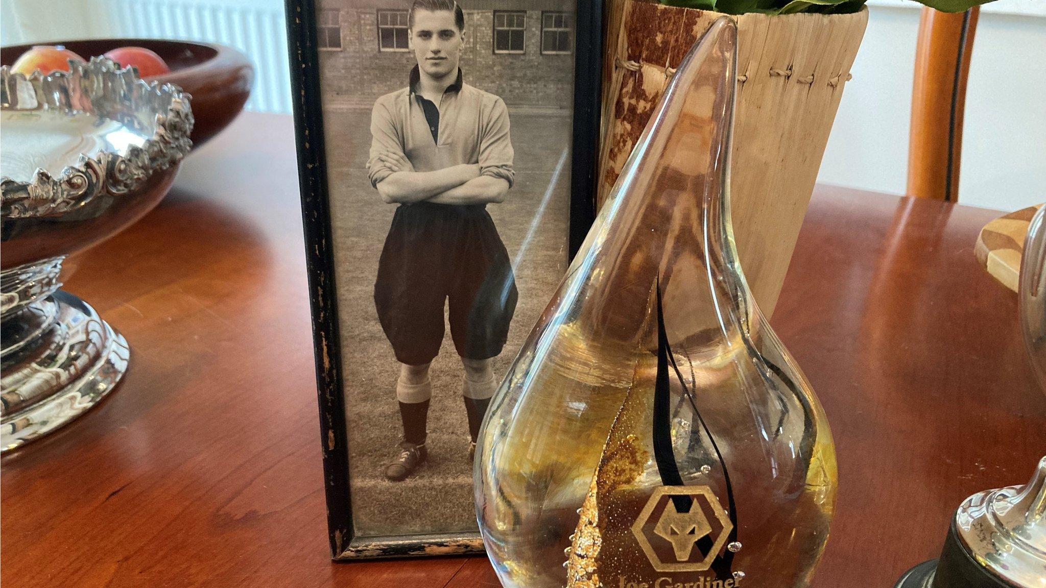 The Hall of Fame award in front of a photo of Joe Gardiner