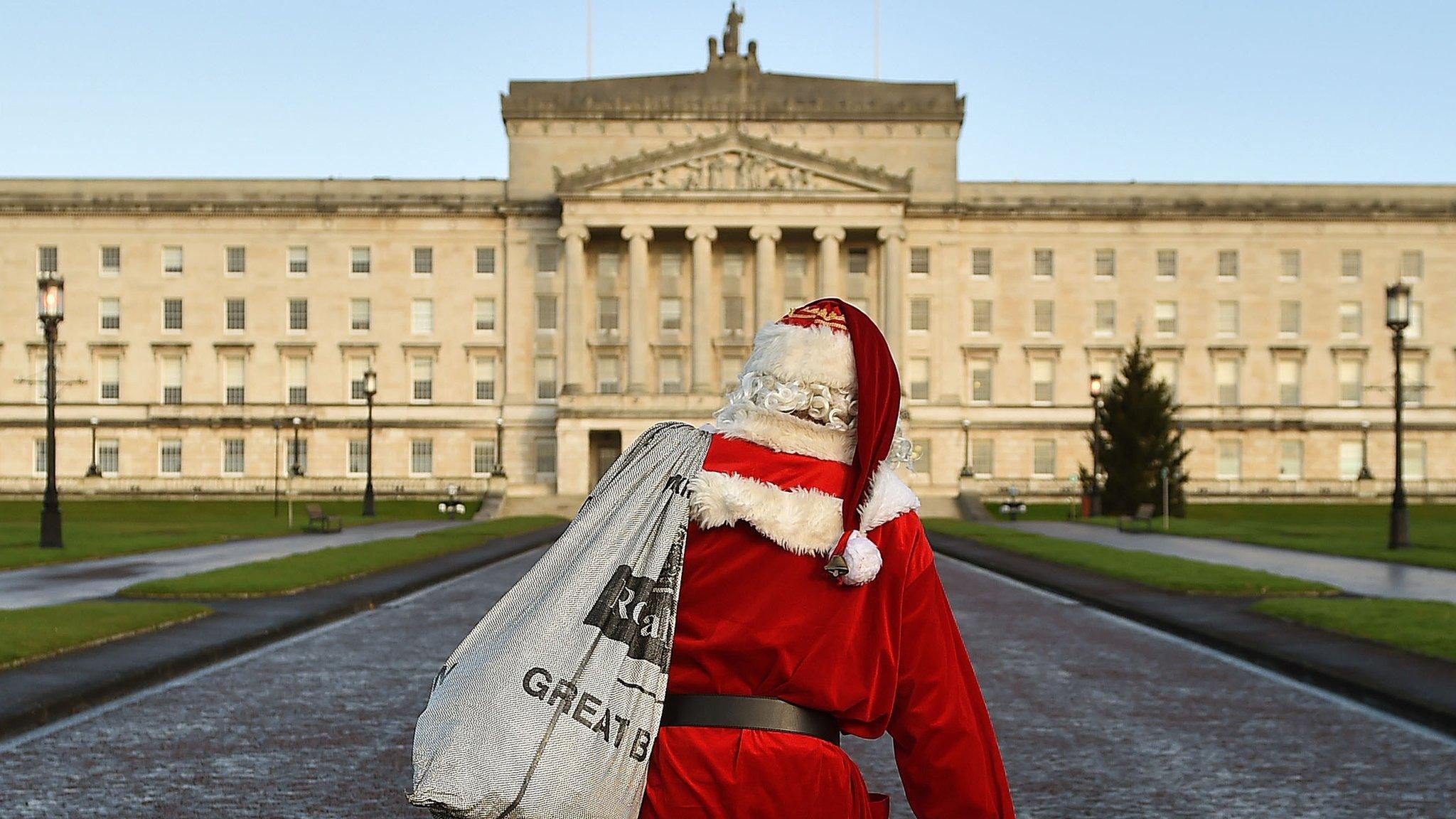 Santa Claus walking towards Parliament Buildings at Stormont