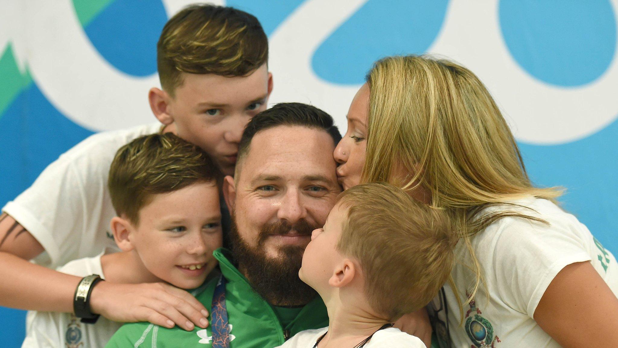 Phillip Eaglesham with his wife Julie and sons Mason, Travis and Tyler after competing in Rio on Tuesday