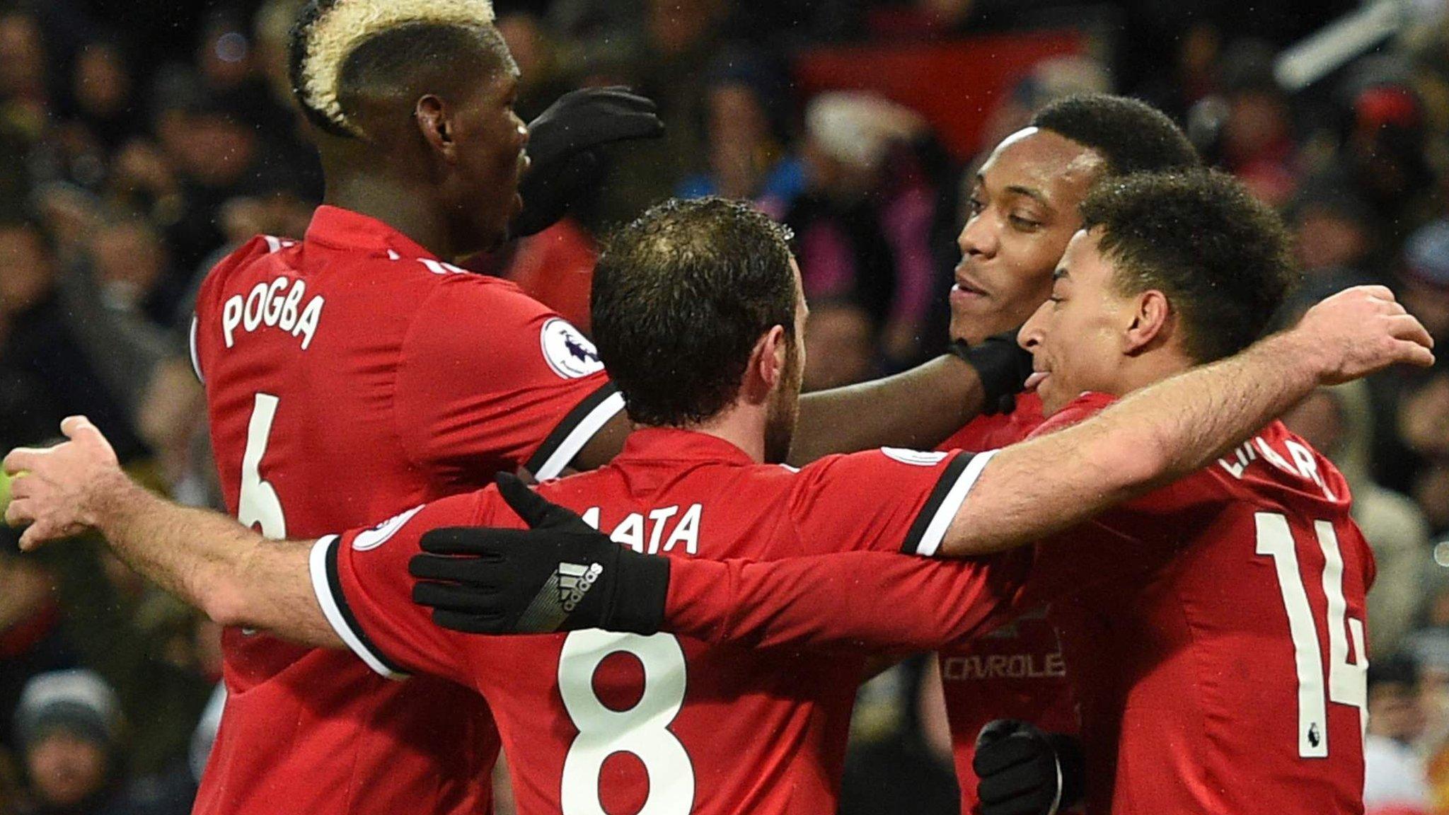 Manchester United players celebrate scoring against Stoke