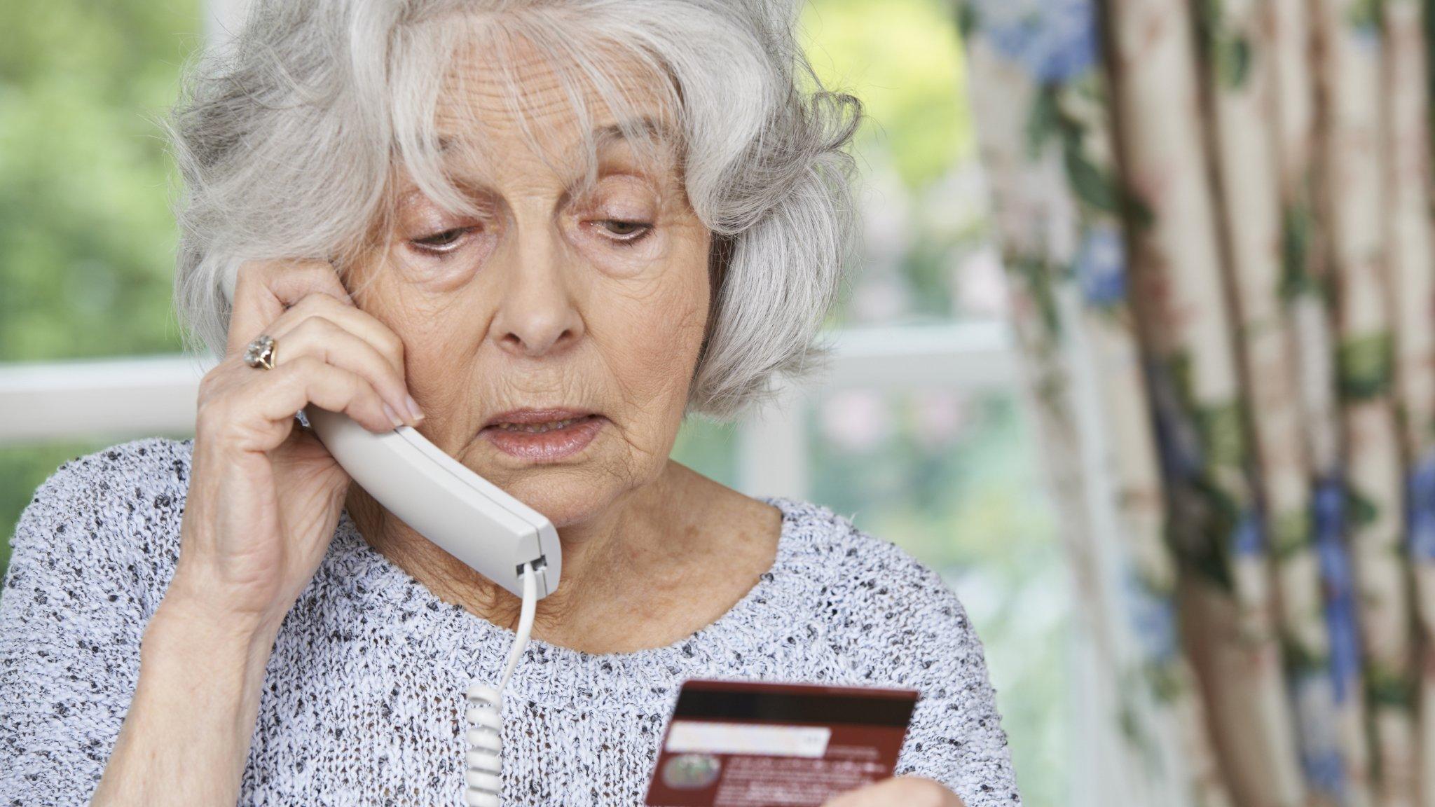 Woman giving credit card details on her phone