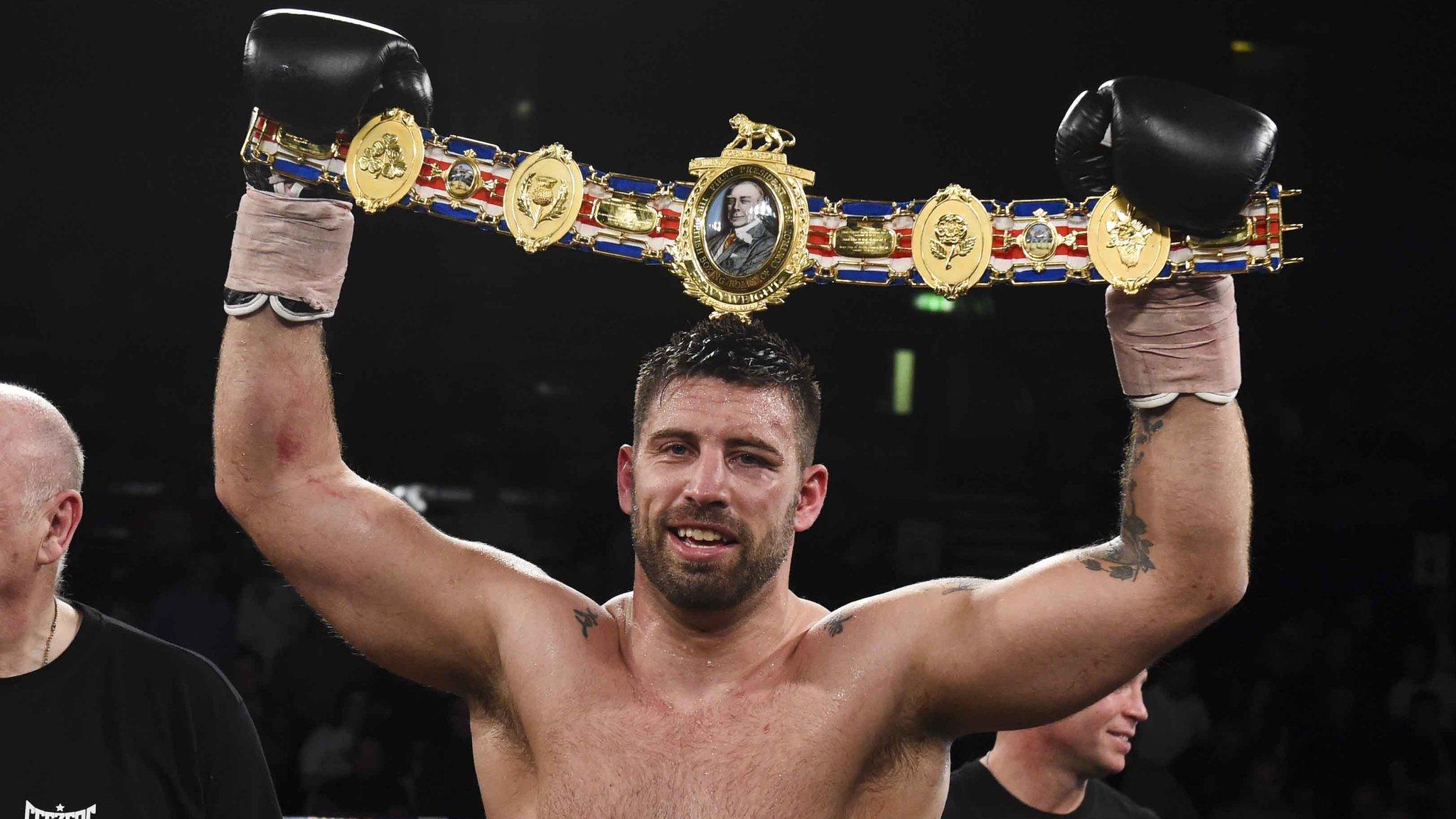 Sam Sexton holds aloft the British heavyweight belt