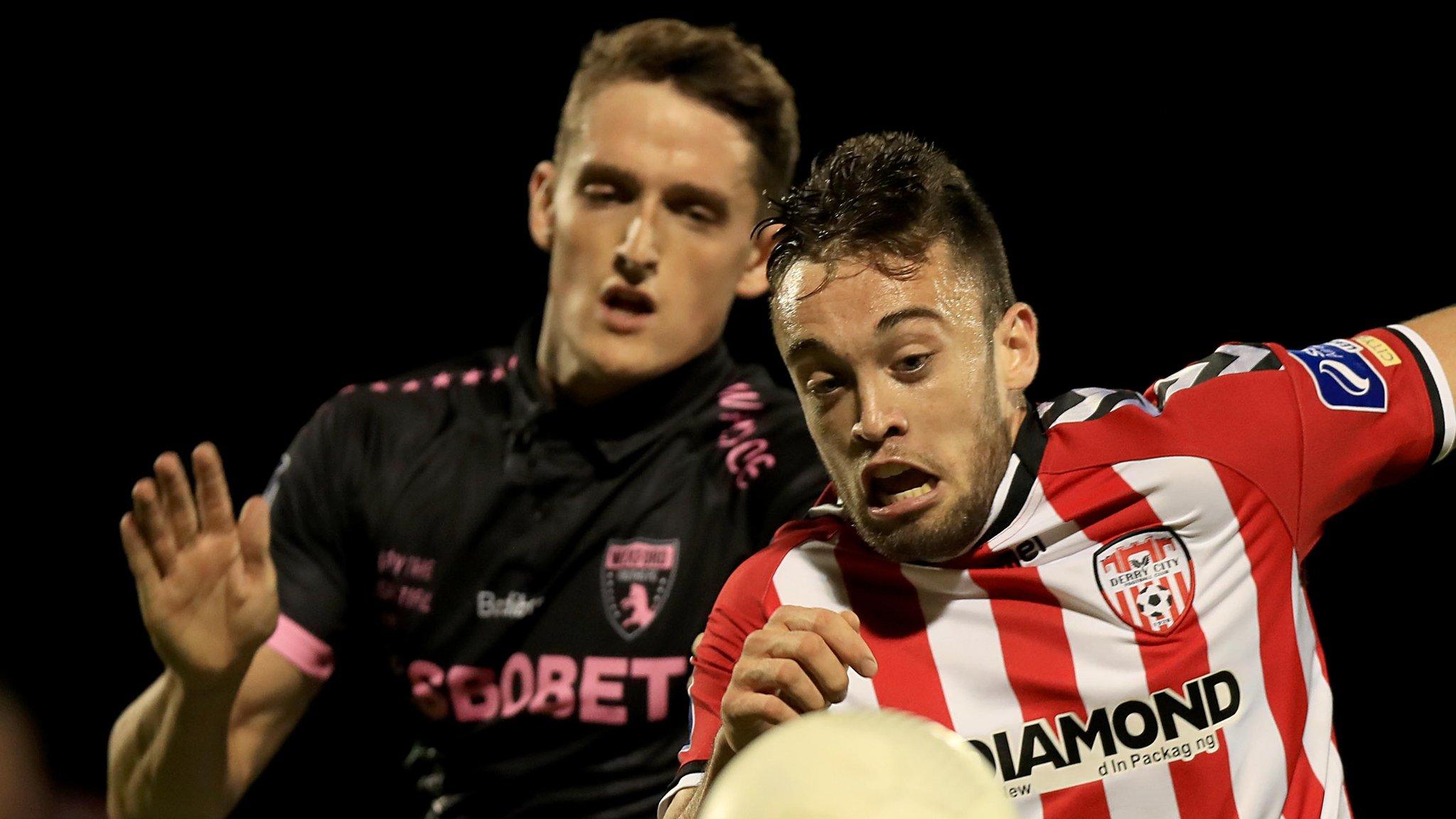 Derry's Nathan Boyle battles with Lee Grace at Ferrycarrig Park