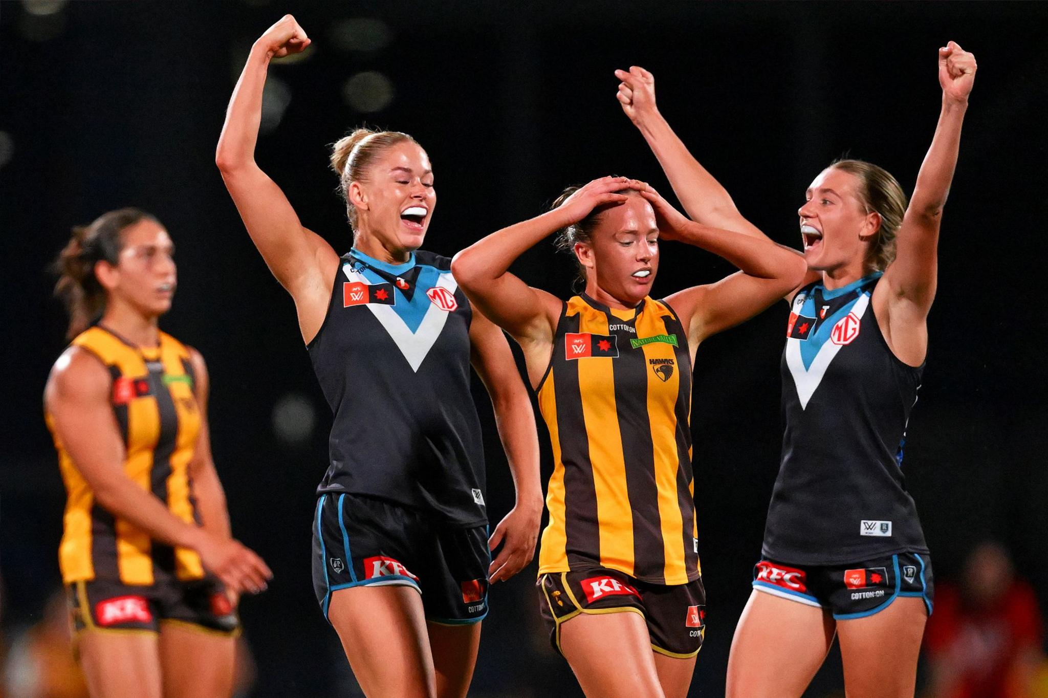 Ashleigh Saint and Ella Boag of the Power celebrate winning the AFLW semi-final match between Hawthorn Hawks and Port Adelaide at Ikon Park, on 16 November 2024, in Melbourne, Australia.