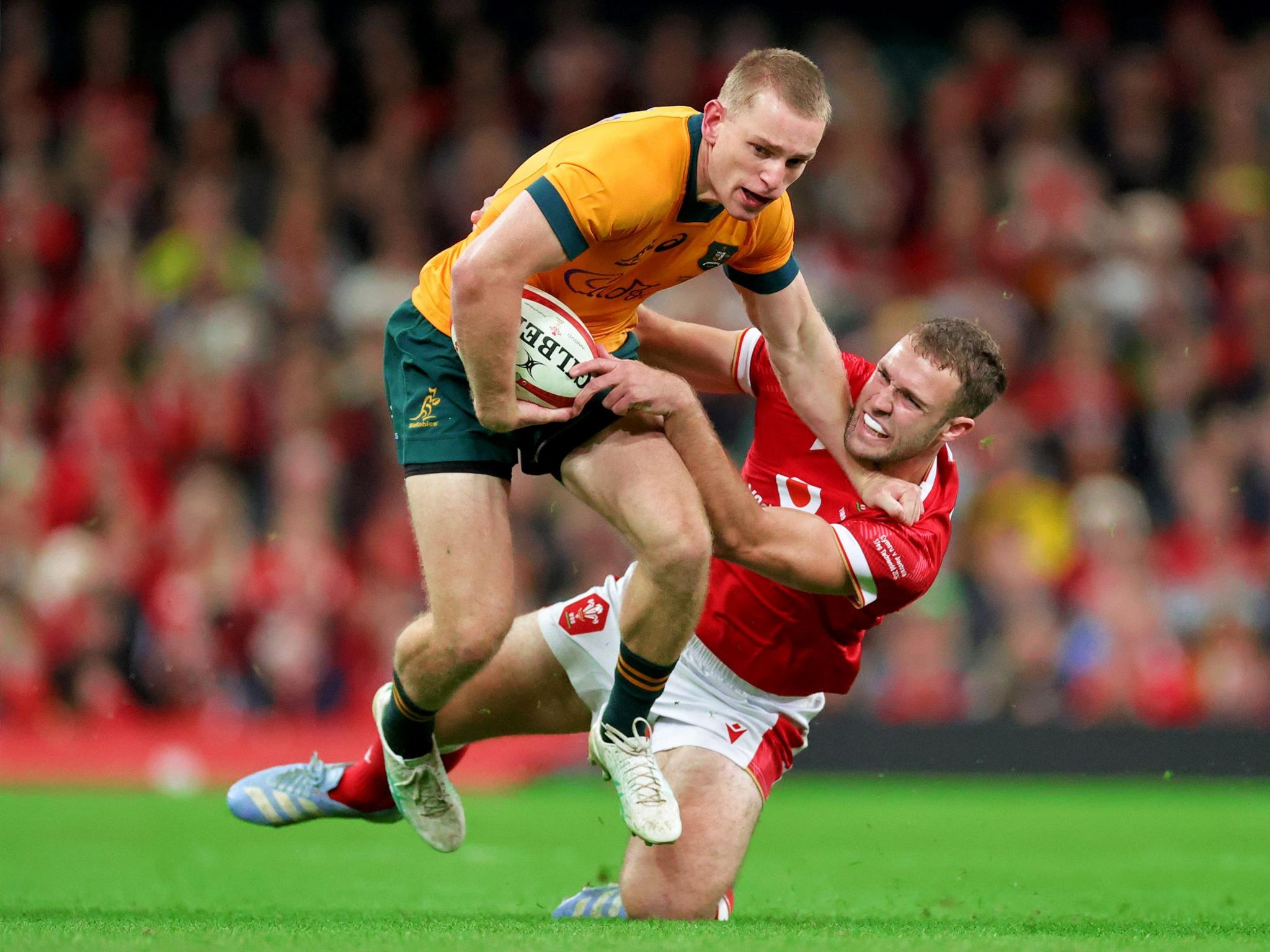 Max Jorgensen of Australia is tackled by Max Llewellyn of Wales during the Autumn Nations Series 2024 match between Wales and Australia at the Principality Stadium on 17 November in Cardiff, Wales.