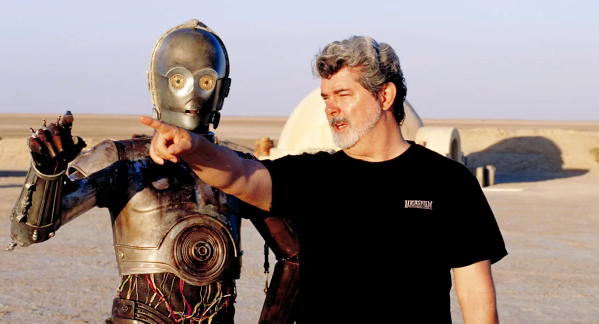 George Lucas directing Star Wars actor Anthony Daniels inside the C-3PO costume in Tunisia.