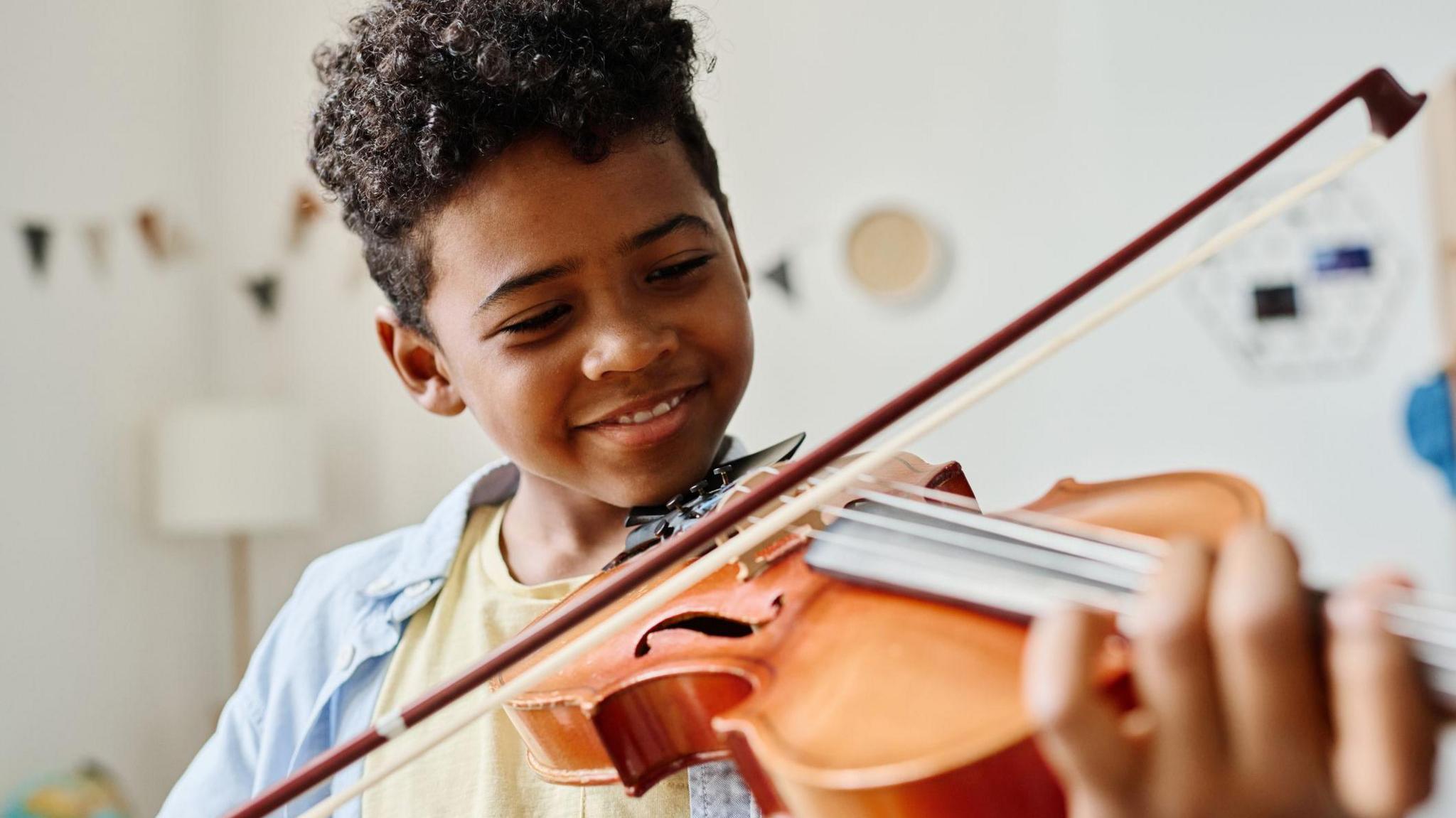 a boy playing the Violin