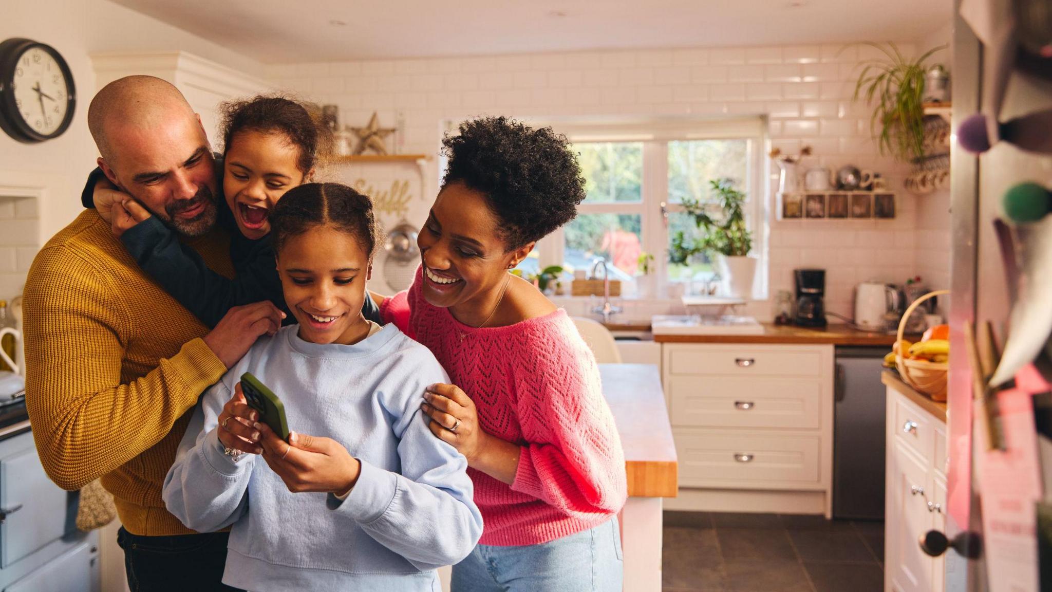 A family looking at a phone