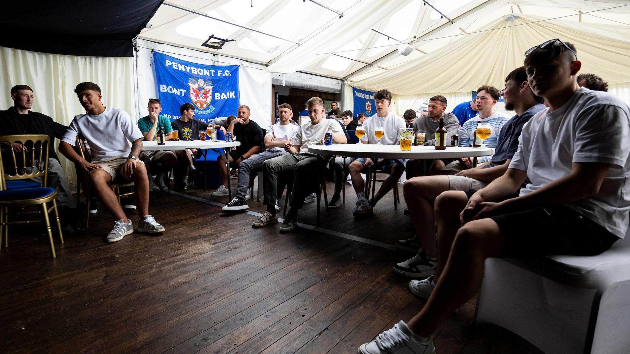 Penybont players and fans watching the Welsh Cup final