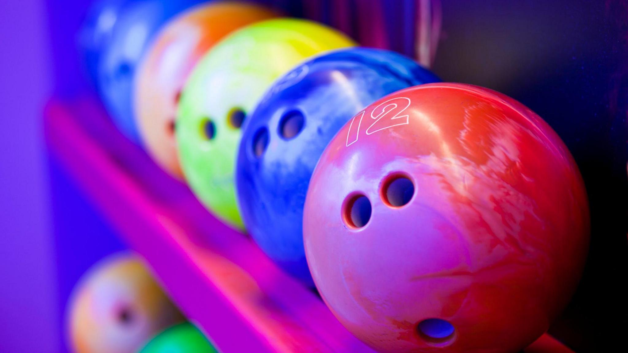 A row of coloured bowling balls