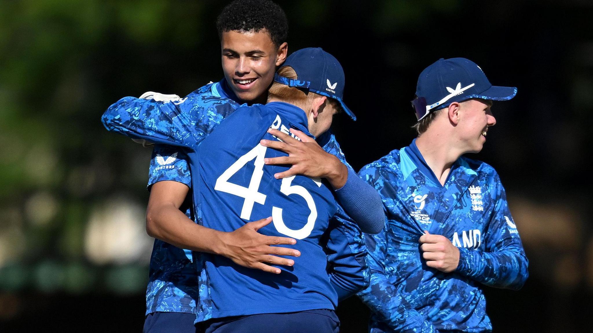 Manny Lumsden celebrates taking a wicket against New Zealand with his England team-mates
