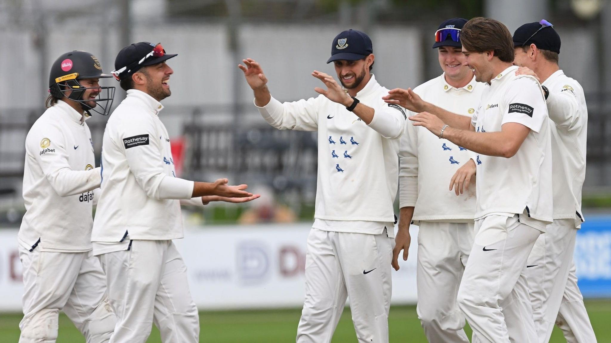 Sussex celebrate a wicket for James Coles against Yorkshire in 2025