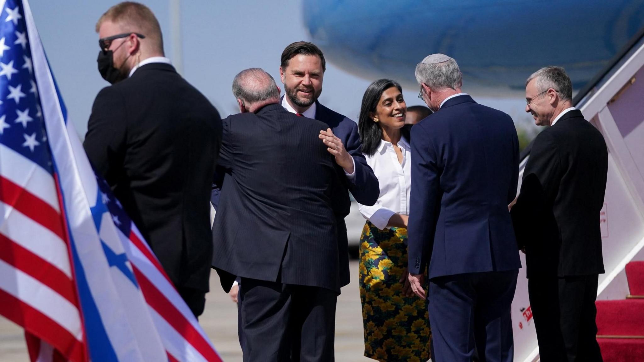 US Vice-President JD Vance (3rd L) and his wife Usha (3rd R) are greeted by the US ambassador to Israel, Mike Huckabee (2nd L), and Israeli Deputy Prime Minister Yariv Levin (R) after landing in Tel Aviv, Israel (21 October 2025)