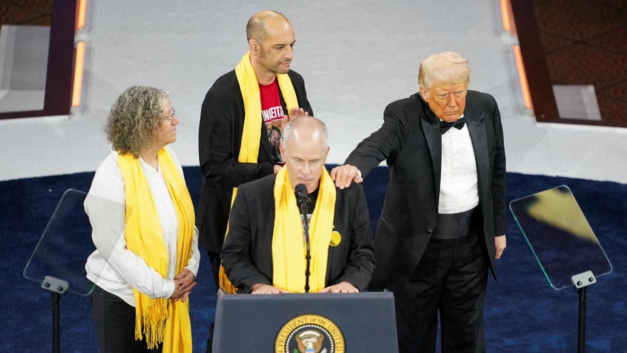 Keith Siegel, flanked by his wife Aviva Siegel and fellow former hostage Iair Horn, was comforted by President Donald Trump while he addressed the National Republican Congressional Committee (NRCC) dinner in Washington DC on 8 April 2025
