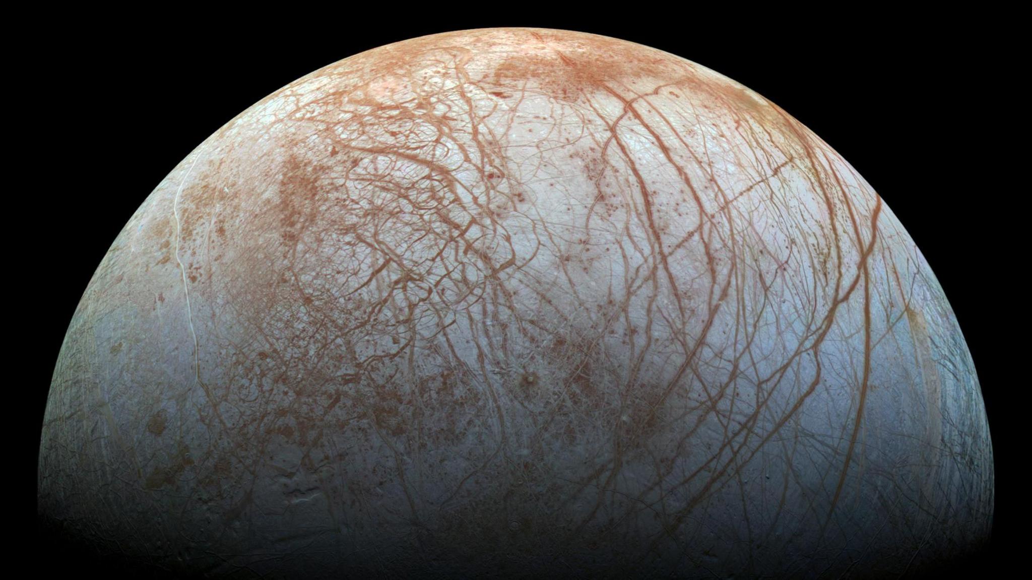 The puzzling, fascinating surface of Jupiter's icy moon Europa looms large in this newly-reprocessed color view, made from images taken by NASA's Galileo spacecraft in the late 1990s.