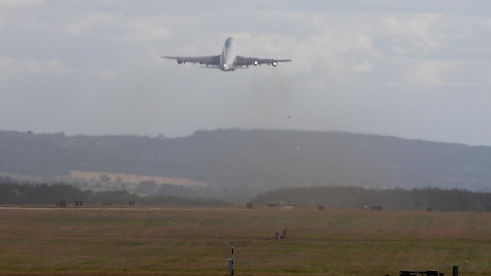Air Force one just after take-off, flying into the distance