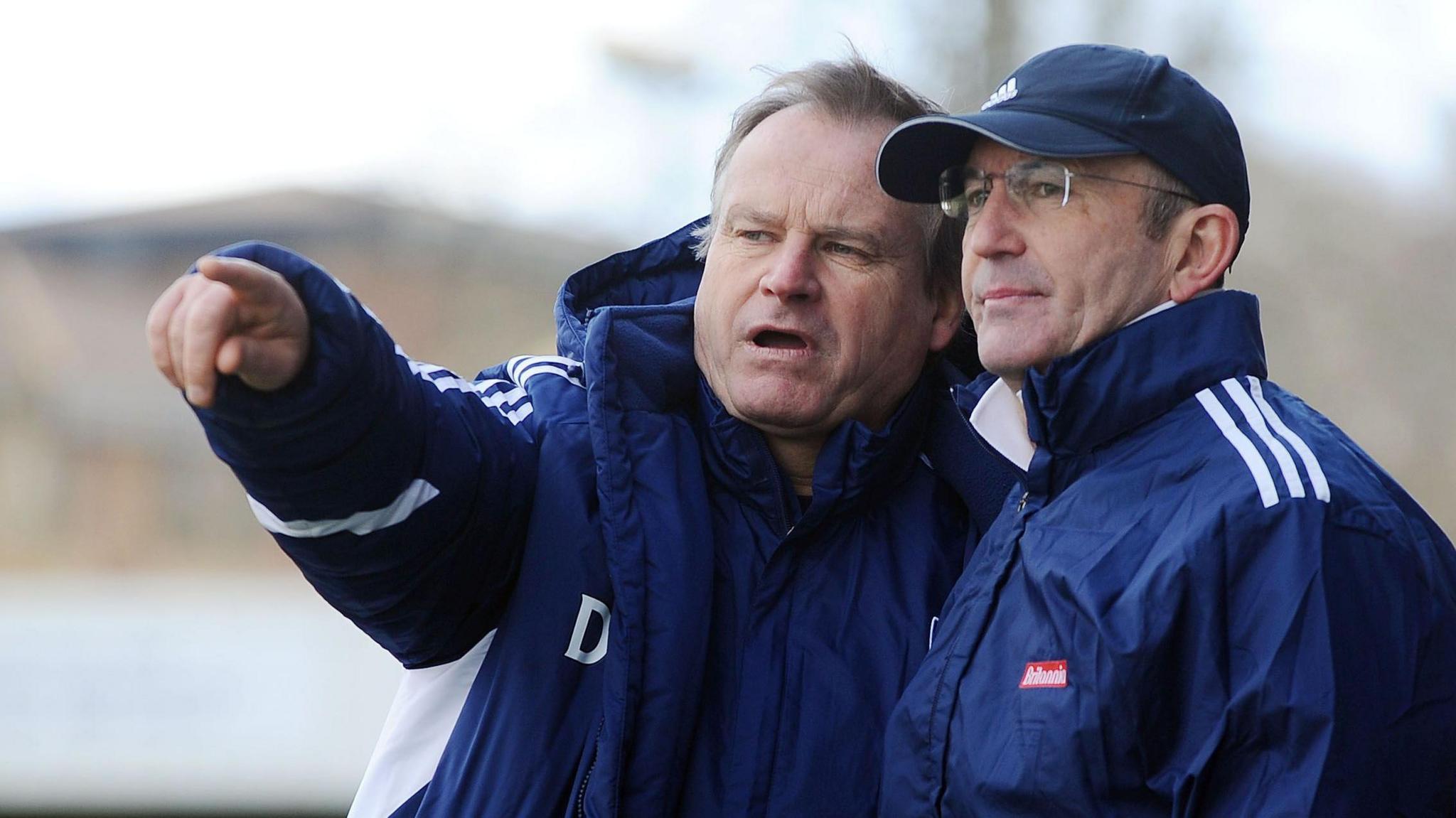 Tony Pulis and his long-time assistant Dave Kemp talk tactics during a game