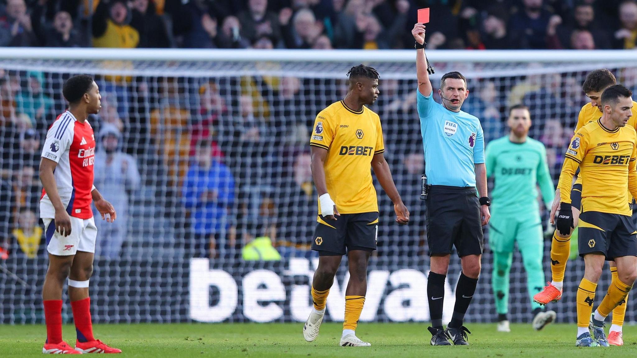 Referee Michael Oliver sends off Arsenal defender Myles Lewis-Skelly against Wolves