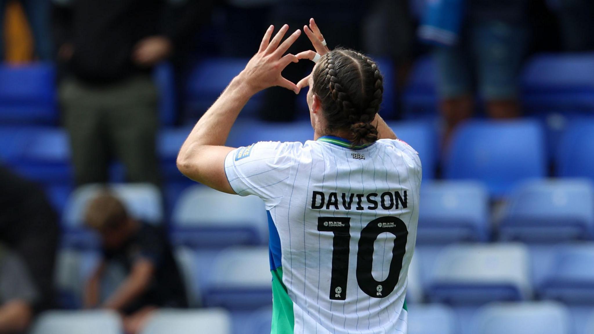 Tranmere Rovers' Josh Davison makes a heart shape with his hands to the crowd after scoring against Shrewsbury