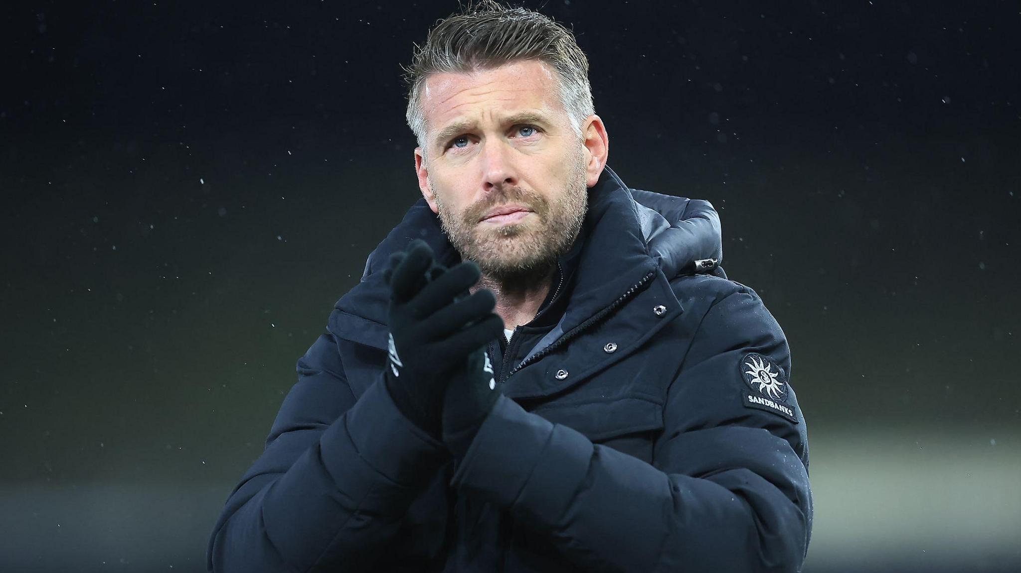 Luton manager Rob Edwards claps the fans