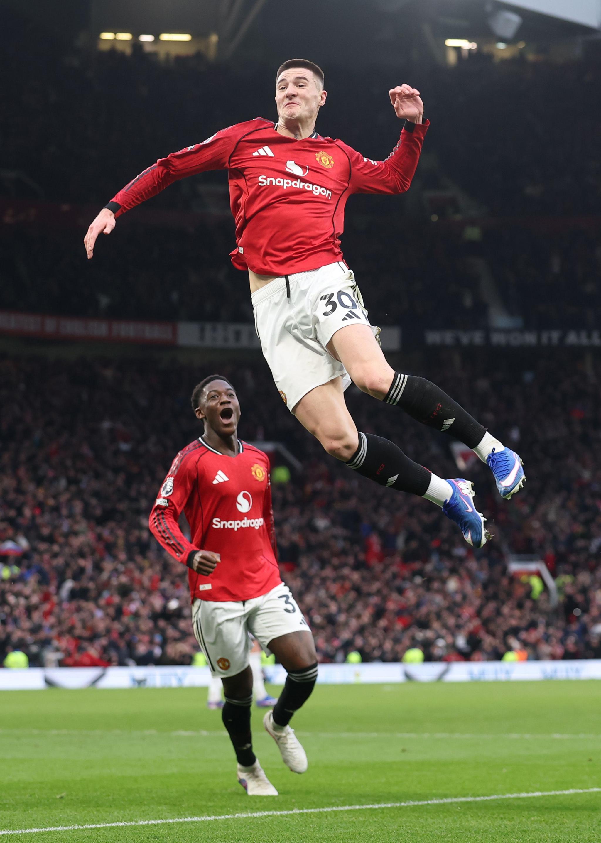 Manchester United's Benjamin Sesko leaps high into the air at Old Trafford after scoring his side's dramatic, late third goal in a 3-2 win over Fulham in the Premier League. 