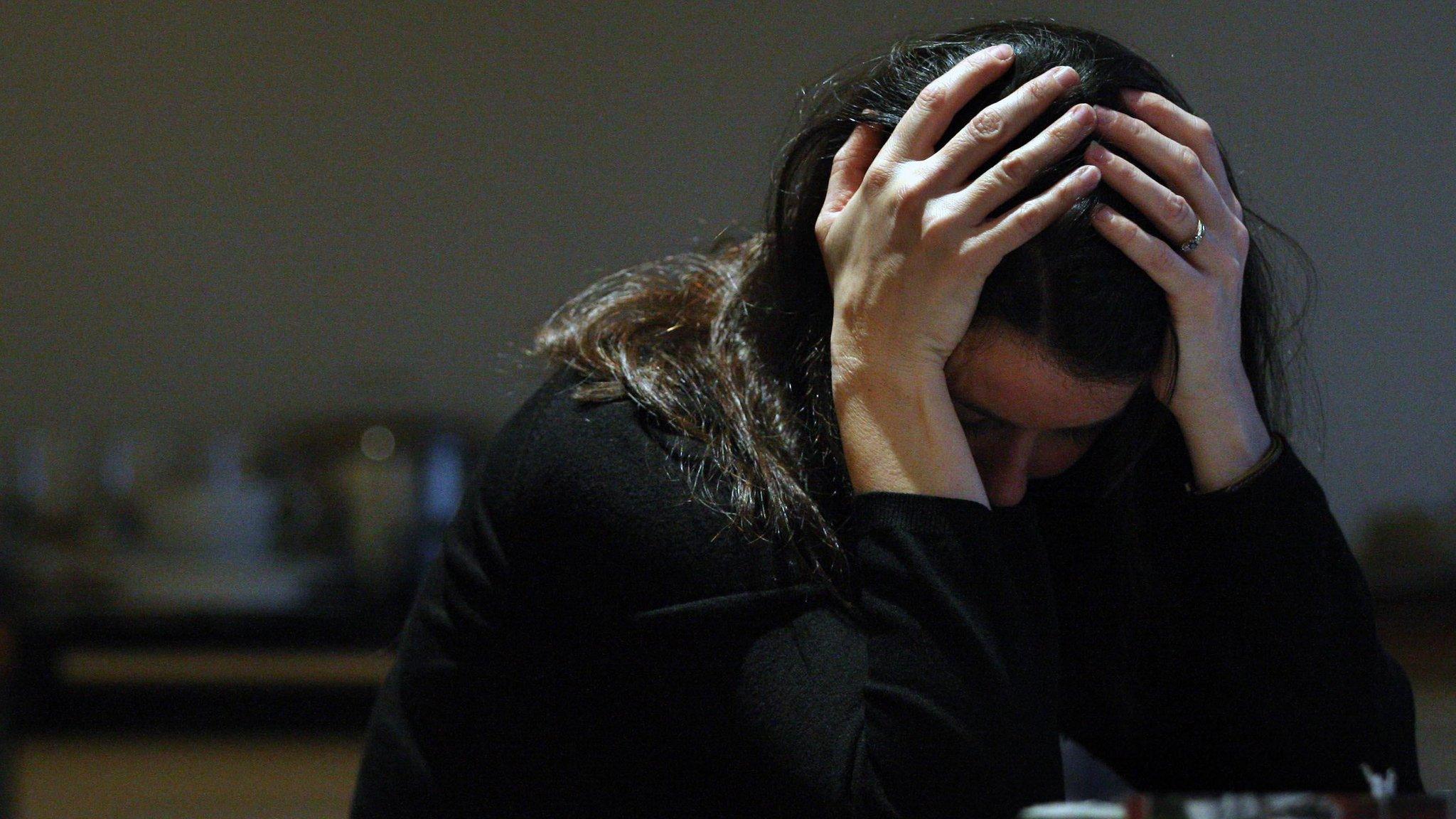 Stock photograph of domestic violence victim