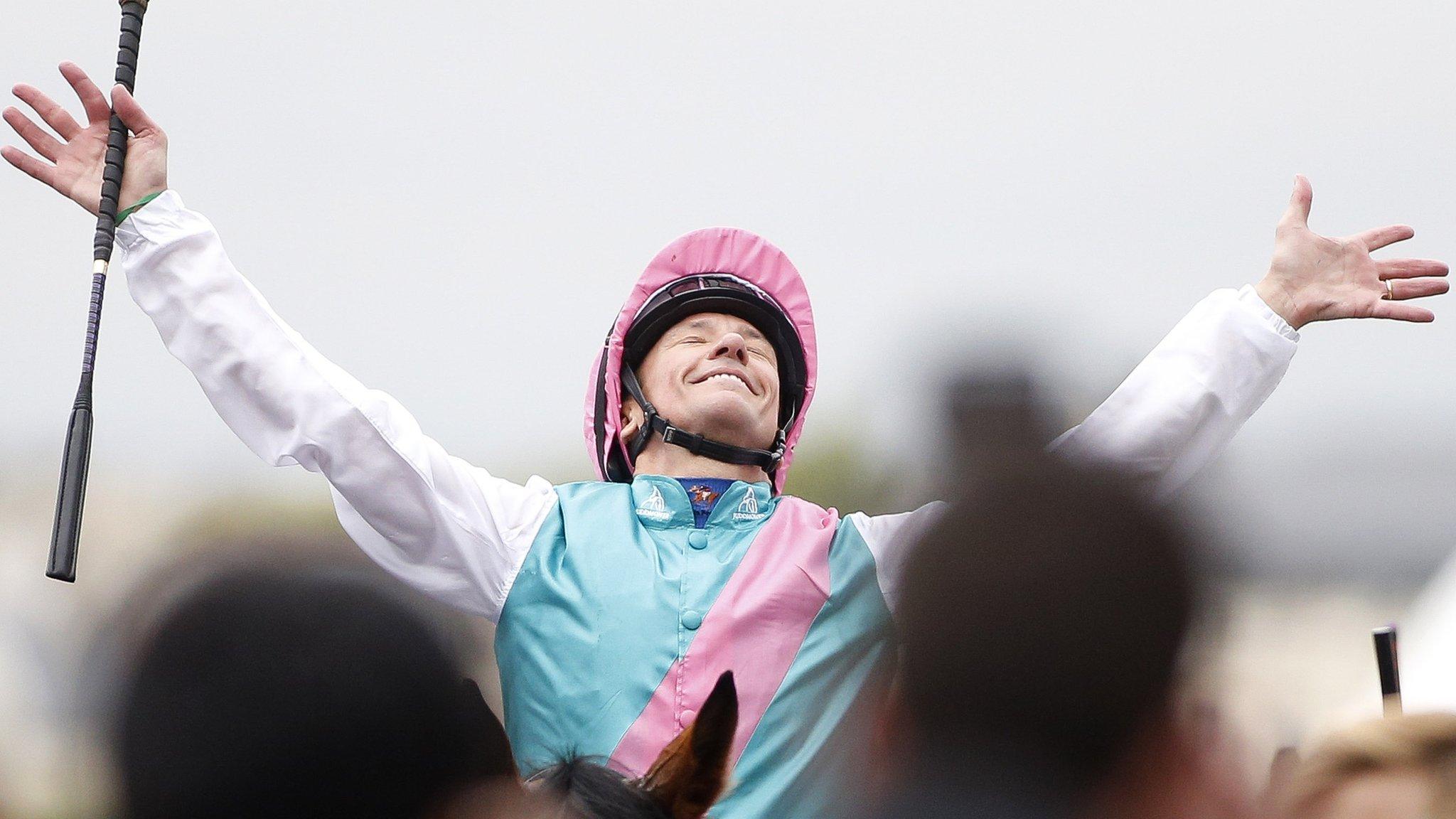 Frankie Dettori celebrates after victory in the Prix de l'Arc de Triomphe