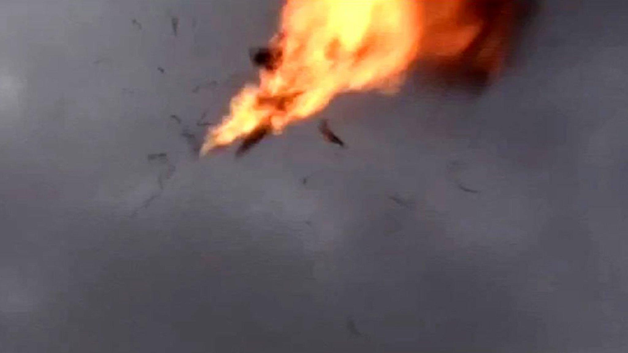 A screengrab from a video shows the moment a drone explodes above Yemen's al-Anad military base in Lahj province (10 January 2018)