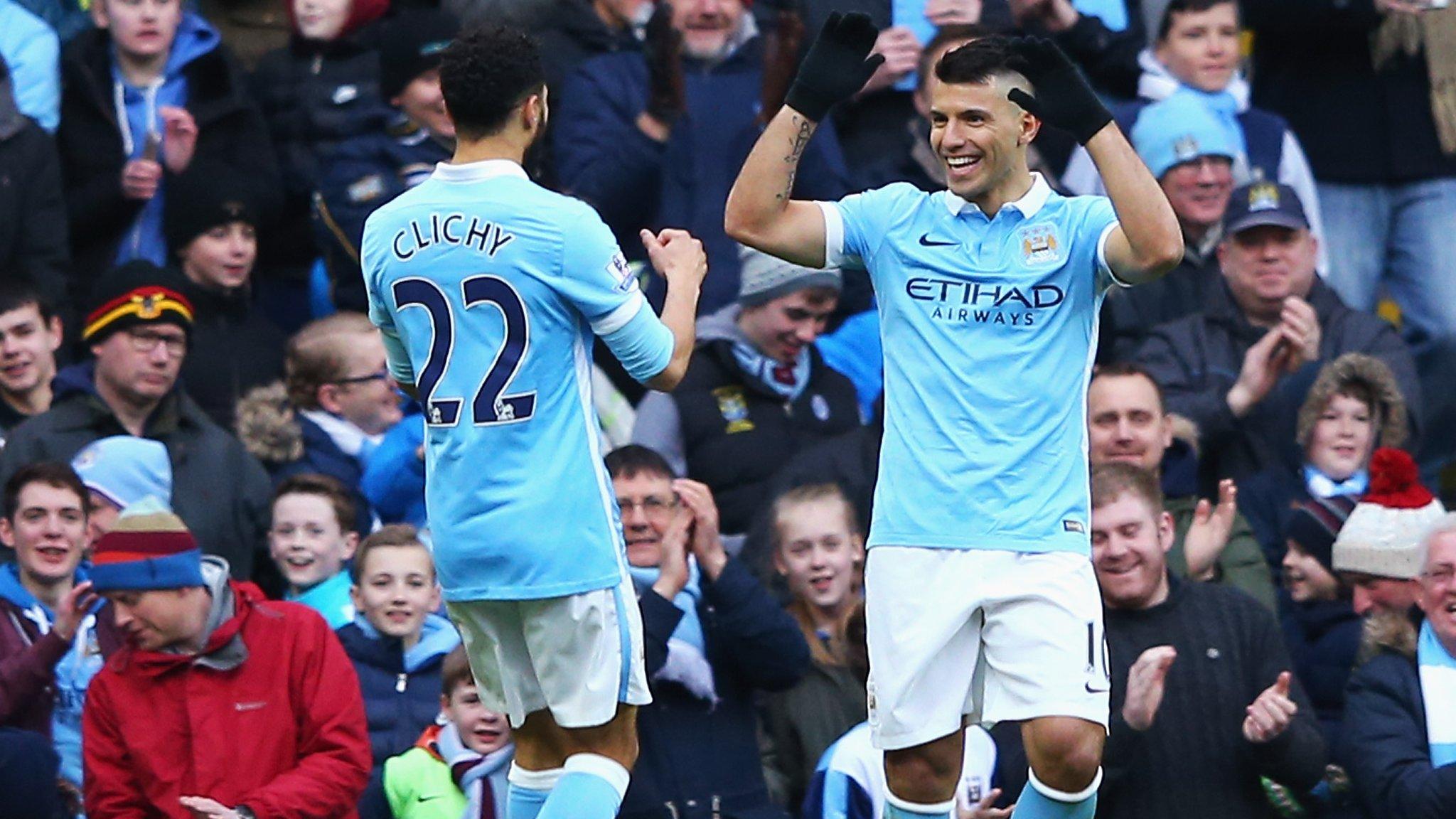 Sergio Aguero celebrates with Gael Clichy