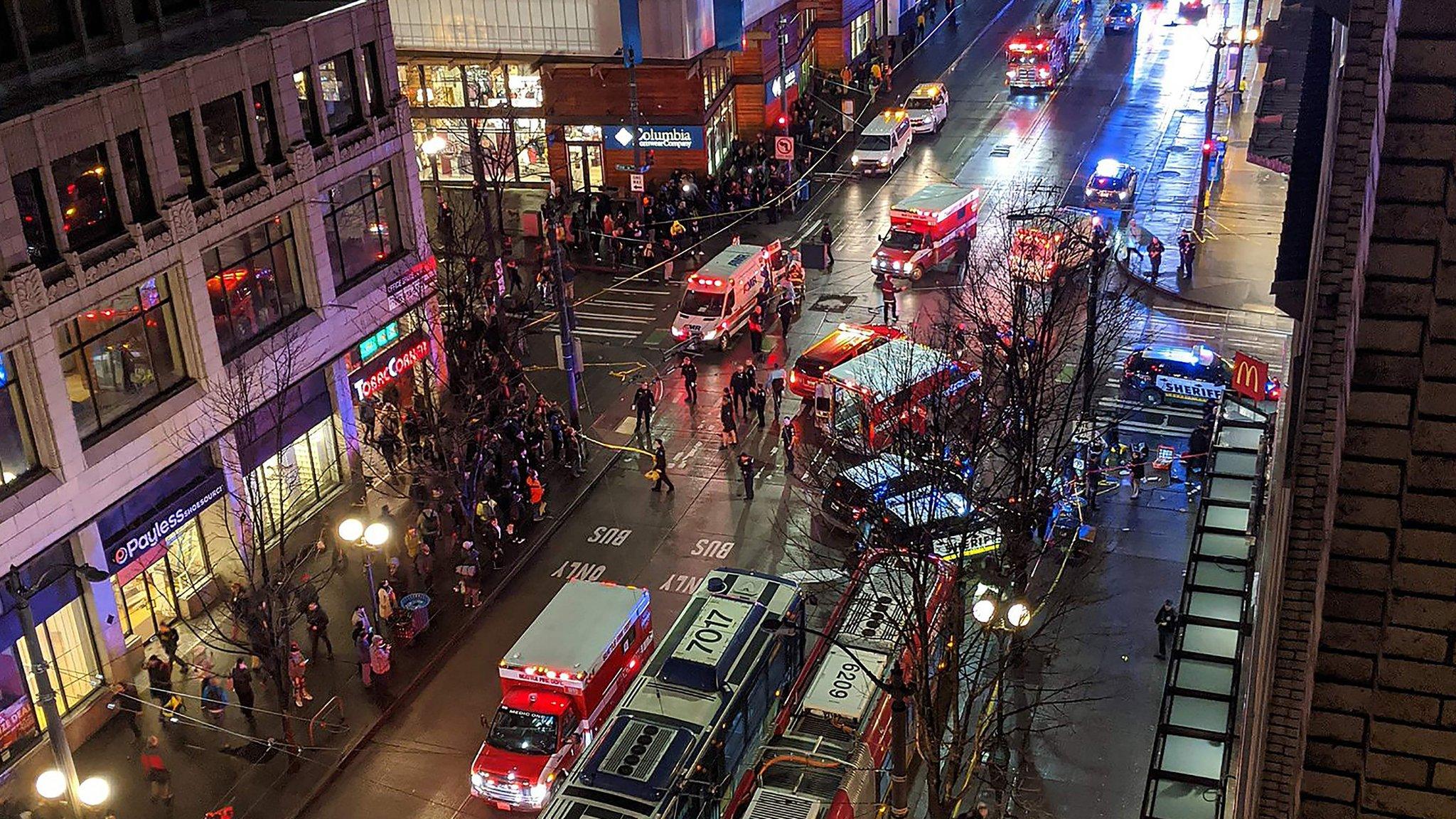 Police at the scene of a shooting which left one dead and seven injured on Pine street in central Seattle, Washington State. 22 Jan 2020