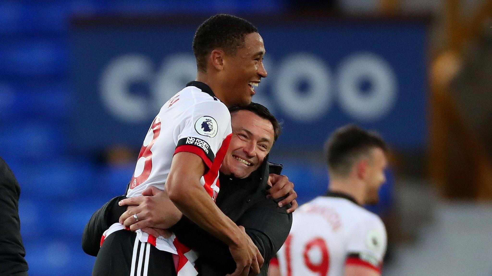 Paul Heckingbottom lifts up Daniel Jebbison after his winner at Everton in May 2021