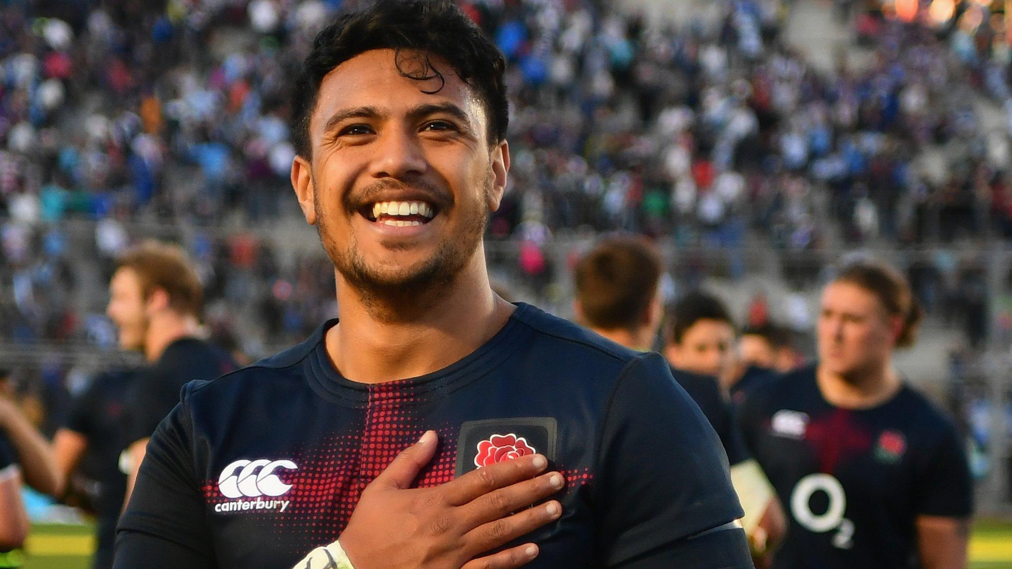 Match-winner Denny Solomona puts his hand on the Red Rose on his England shirt in celebration