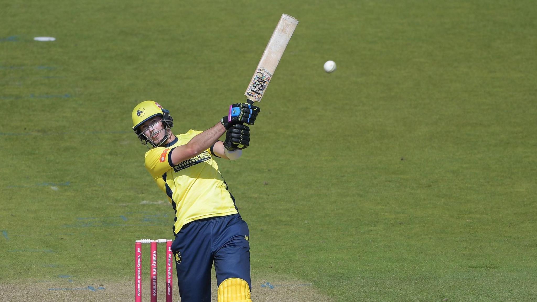 Hampshire's James Fuller hits a six against Kent