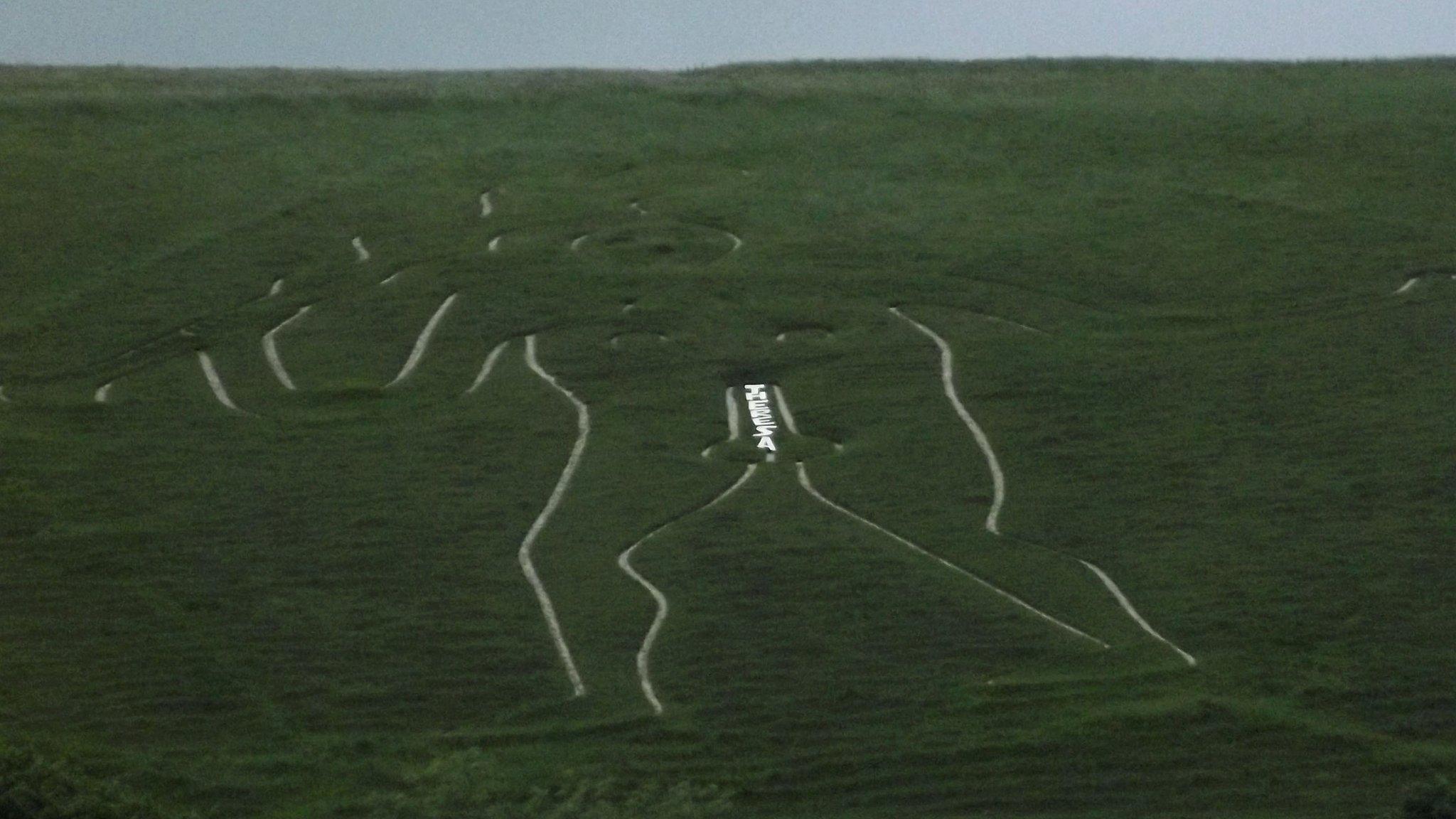 Cerne Giant with Theresa graffiti