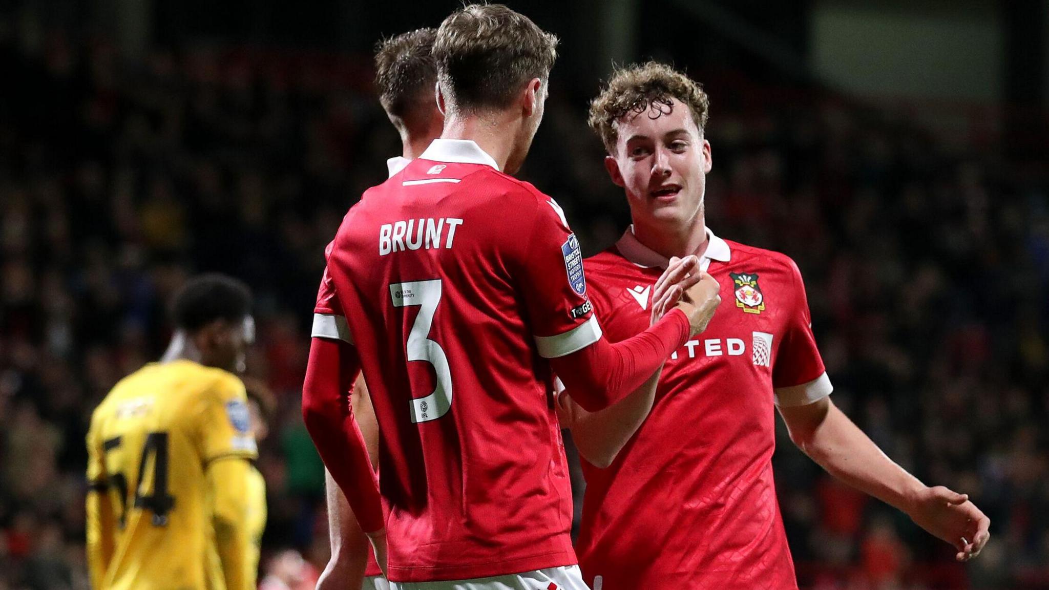 Wrexham celebrate a goal in their 3-0 win over Wolves Under-21s in the EFL Trophy